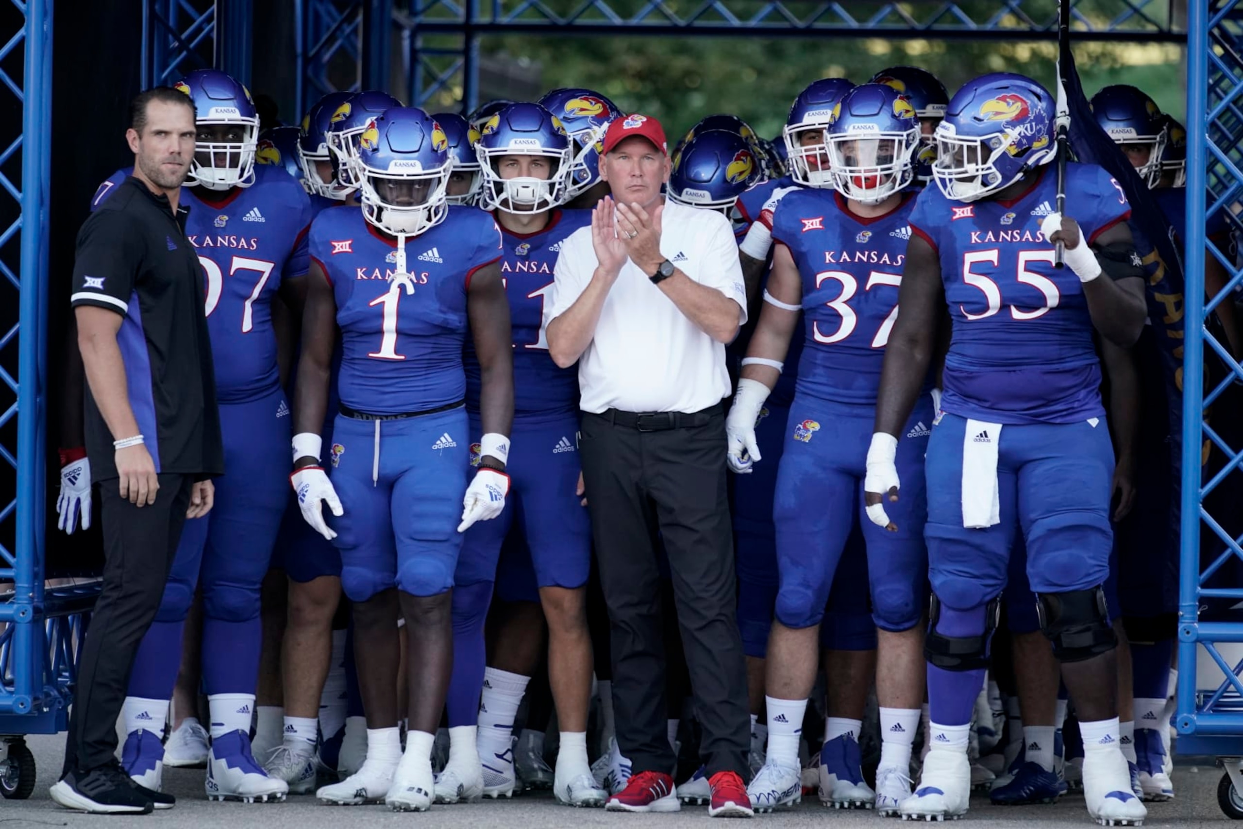 LAWRENCE, KS - SEPTEMBER 02:  Head coach Lance Leipold of the Kansas Jayhawks stands with his team prior to a game against the Tennessee Tech Golden Eagles at David Booth Kansas Memorial Stadium on September 2, 2022 in Lawrence, Kansas. (Photo by Ed Zurga/Getty Images)