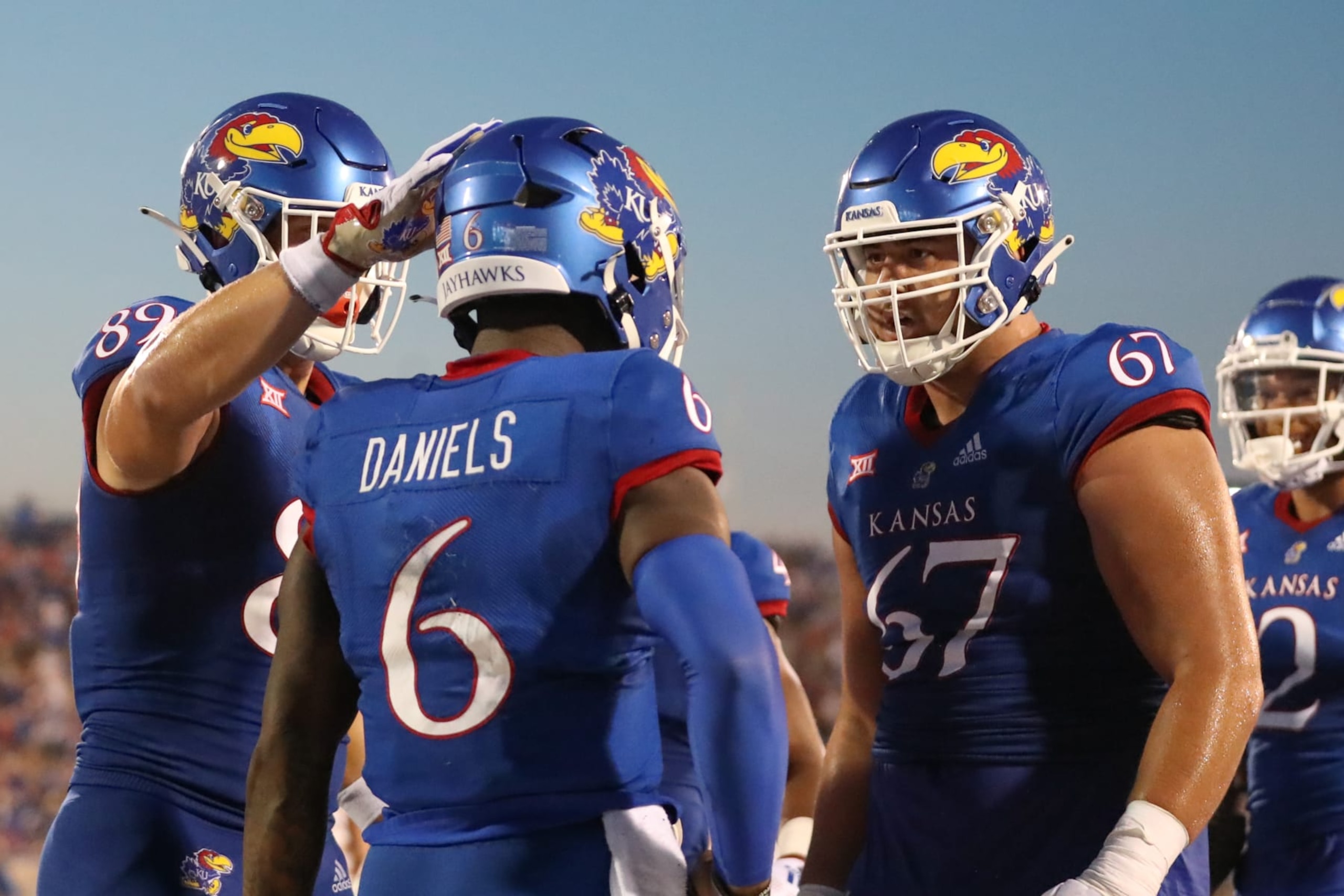 LAWRENCE, KS - SEPTEMBER 02: Kansas Jayhawks quarterback Jalon Daniels (6) is congratulated by offensive lineman Dominick Puni (67) after an 11-yard touchdown run in the second quarter of a college football game between the Tennessee Tech Golden Eagles and Kansas Jayhawks on September 2, 2022 at Memorial Stadium in Lawrence, KS.  Photo by Scott Winters/Icon Sportswire via Getty Images)