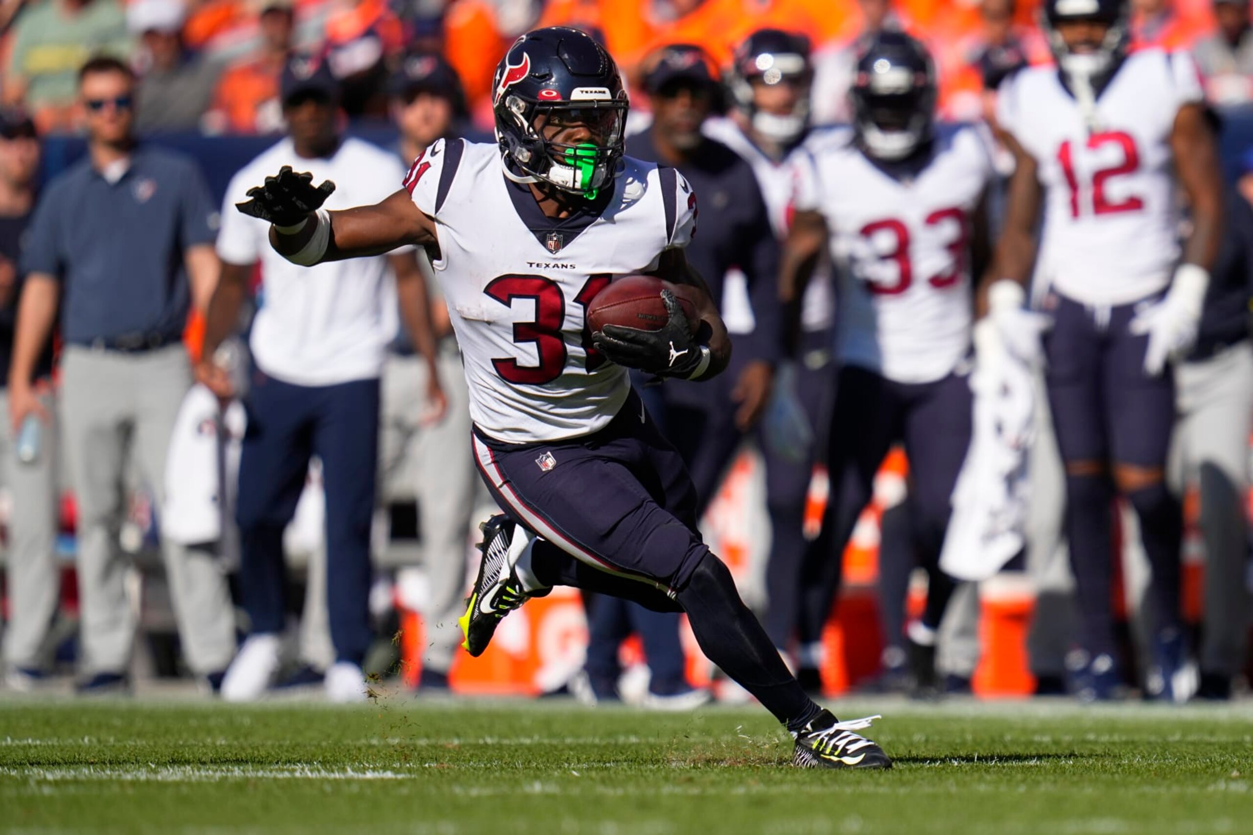 Houston Texans running back Dameon Pierce (31) runs against the Denver Broncos during the second half of an NFL football game, Sunday, Sept. 18, 2022, in Denver. (AP Photo/Jack Dempsey)