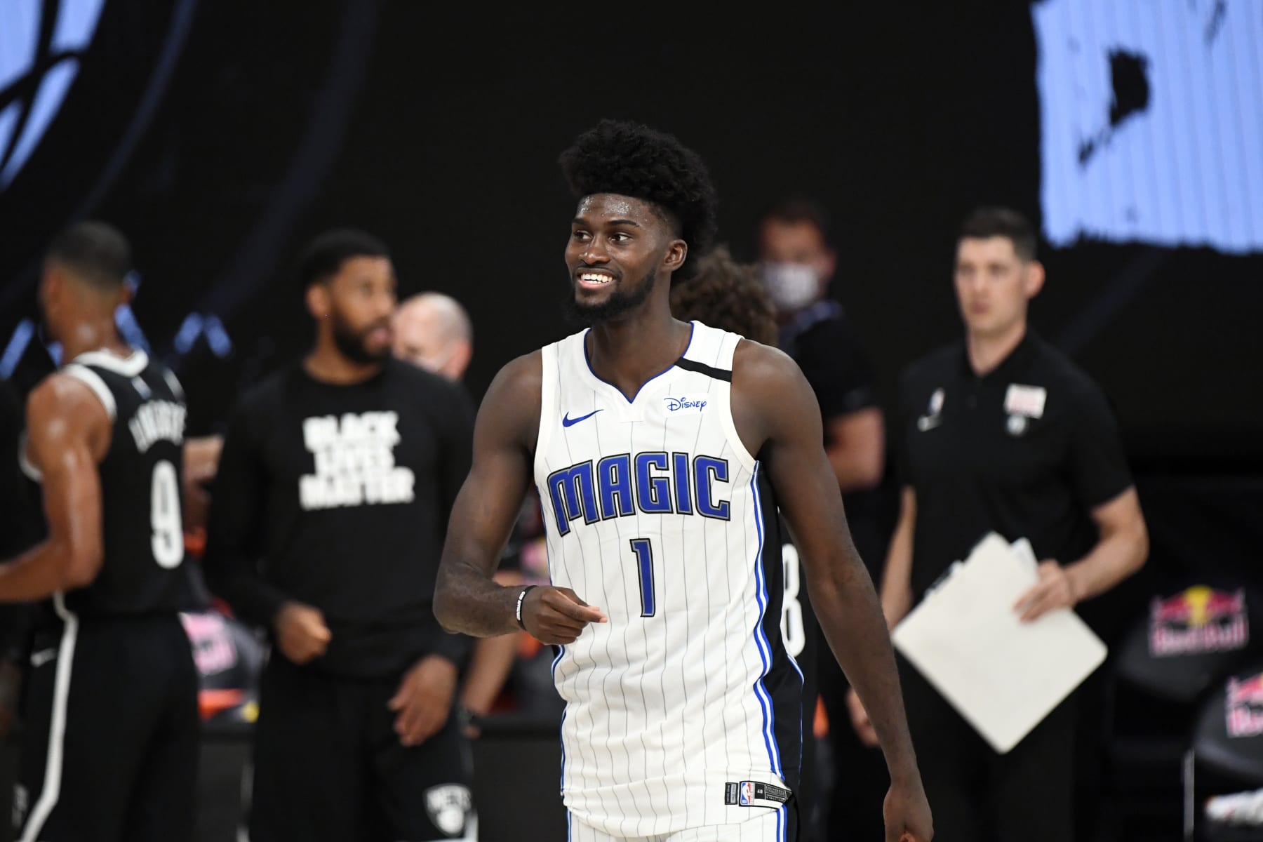 Orlando, FL - JULY 31: Jonathan Isaac #1 of the Orlando Magic smiles during the game against the Brooklyn Nets on July 31, 2020 at The HP Field House at ESPN Wide World Of Sports Complex in Orlando, Florida. NOTE TO USER: User expressly acknowledges and agrees that, by downloading and/or using this Photograph, user is consenting to the terms and conditions of the Getty Images License Agreement. Mandatory Copyright Notice: Copyright 2020 NBAE (Photo by Garrett Ellwood/NBAE via Getty Images)