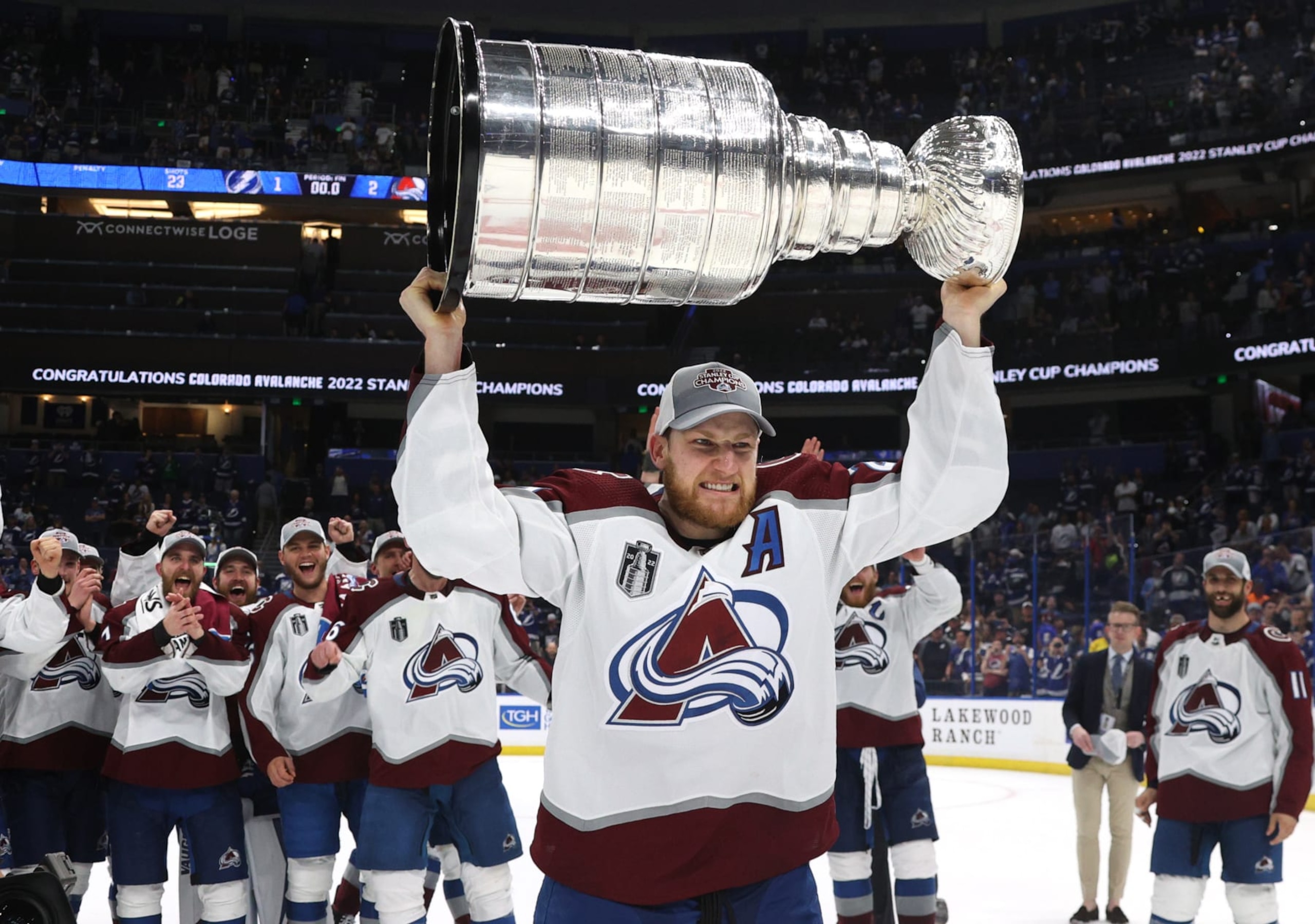 TAMPA, FLORIDA - JUNE 26: Nathan MacKinnon #29 of the Colorado Avalanche hoists the Stanley Cup after the Colorado Avalanche defeated the Tampa Bay Lightning in Game Six of the 2022 Stanley Cup Final at Amalie Arena on June 26, 2022 in Tampa, Florida. The Colorado Avalanche defeated the Tampa Bay Lightning 2-1 in Game Six to take the best of seven Stanley Cup Final series 4 games to 2.  (Photo by Dave Sandford/NHLI via Getty Images)