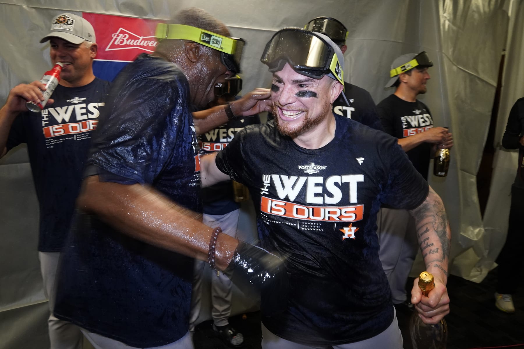 Houston Astros catcher Christian Vazquez, right, celebrates with manager Dusty Baker Jr. after the Astros clinched the American League West title with a win over the Tampa Bay Rays during a baseball game Monday, Sept. 19, 2022, in St. Petersburg, Fla. (AP Photo/Chris O'Meara)