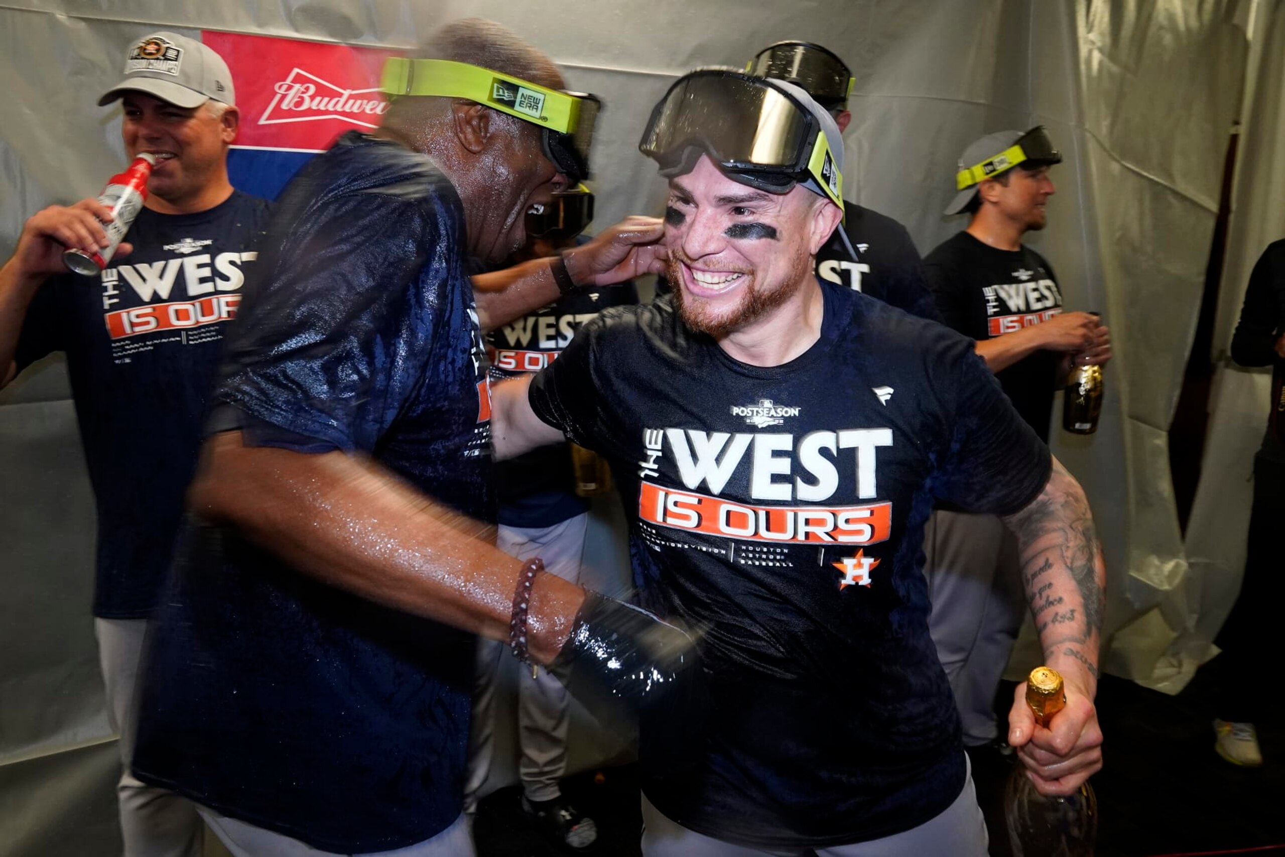 Houston Astros catcher Christian Vazquez, right, celebrates with manager Dusty Baker Jr. after the Astros clinched the American League West title with a win over the Tampa Bay Rays during a baseball game Monday, Sept. 19, 2022, in St. Petersburg, Fla. (AP Photo/Chris O'Meara)