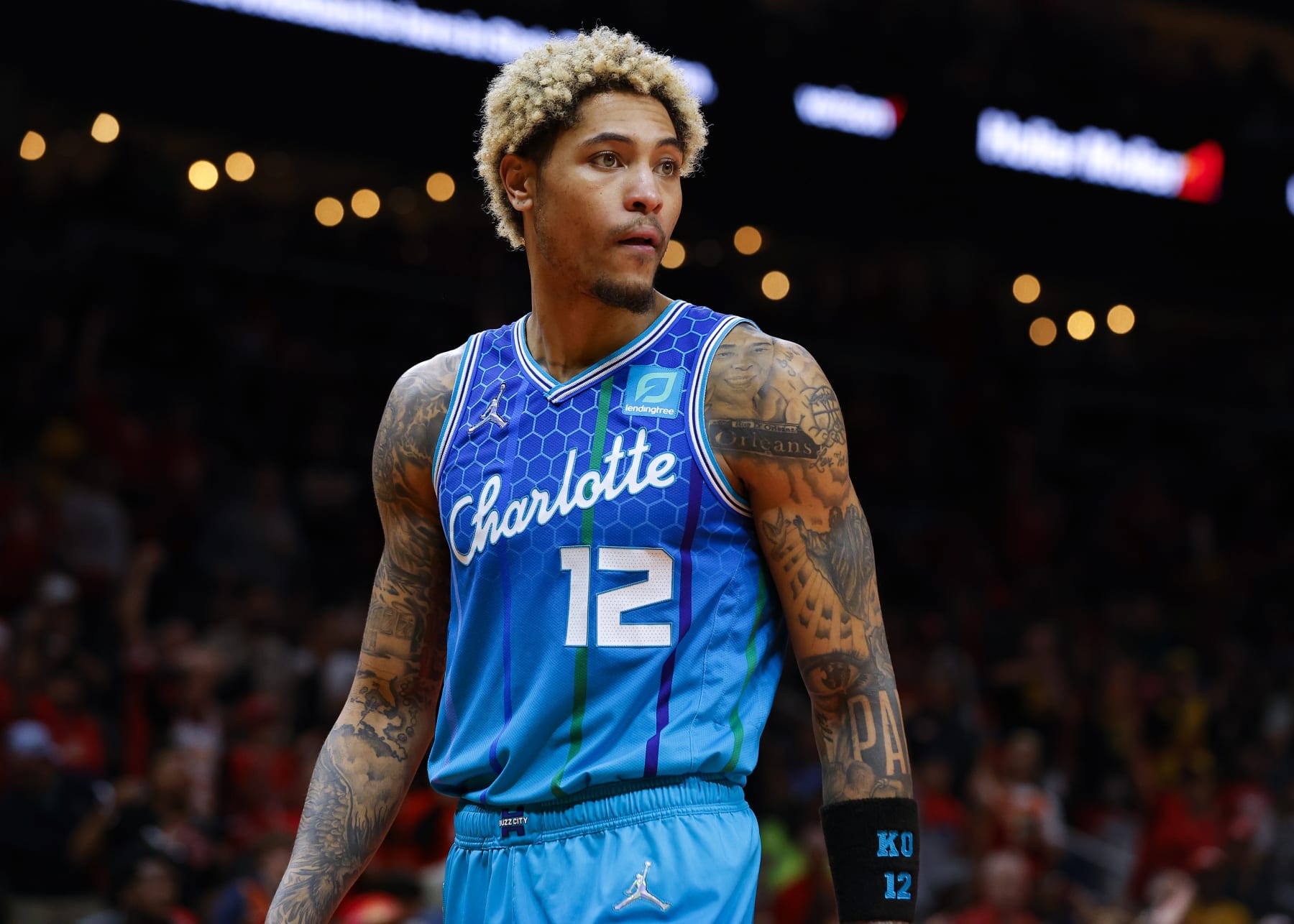 ATLANTA, GA - APRIL 13: Kelly Oubre Jr. #12 of the Charlotte Hornets reacts during a break in play during the second half against the Atlanta Hawks at State Farm Arena on April 13, 2022 in Atlanta, Georgia. NOTE TO USER: User expressly acknowledges and agrees that, by downloading and or using this photograph, User is consenting to the terms and conditions of the Getty Images License Agreement. (Photo by Todd Kirkland/Getty Images)