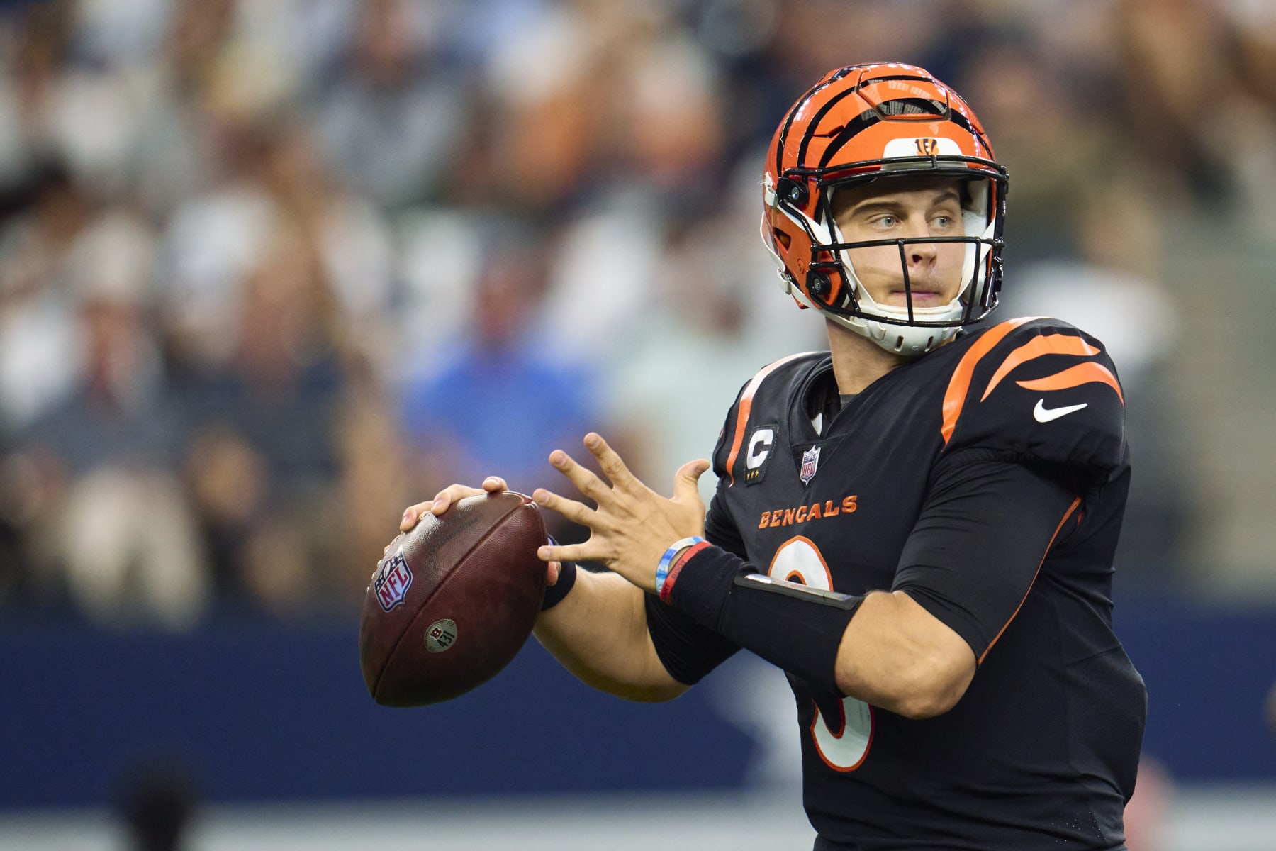 ARLINGTON, TX - SEPTEMBER 18: Joe Burrow #9 of the Cincinnati Bengals drops back to pass against the Dallas Cowboys at AT&T Stadium on September 18, 2022 in Arlington, Texas. (Photo by Cooper Neill/Getty Images) ARLINGTON, TX - SEPTEMBER 18: Joe Burrow #9 of the Cincinnati Bengals drops back to pass against the Dallas Cowboys at AT&T Stadium on September 18, 2022 in Arlington, Texas. (Photo by Cooper Neill/Getty Images)
