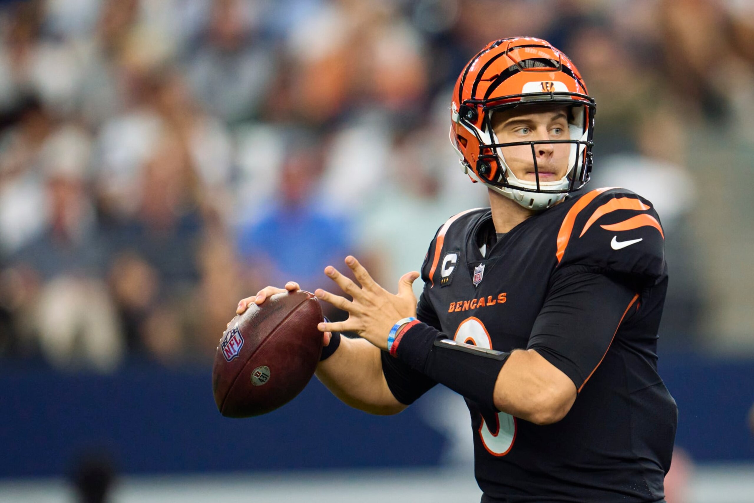 ARLINGTON, TX - SEPTEMBER 18: Joe Burrow #9 of the Cincinnati Bengals drops back to pass against the Dallas Cowboys at AT&T Stadium on September 18, 2022 in Arlington, Texas. (Photo by Cooper Neill/Getty Images)