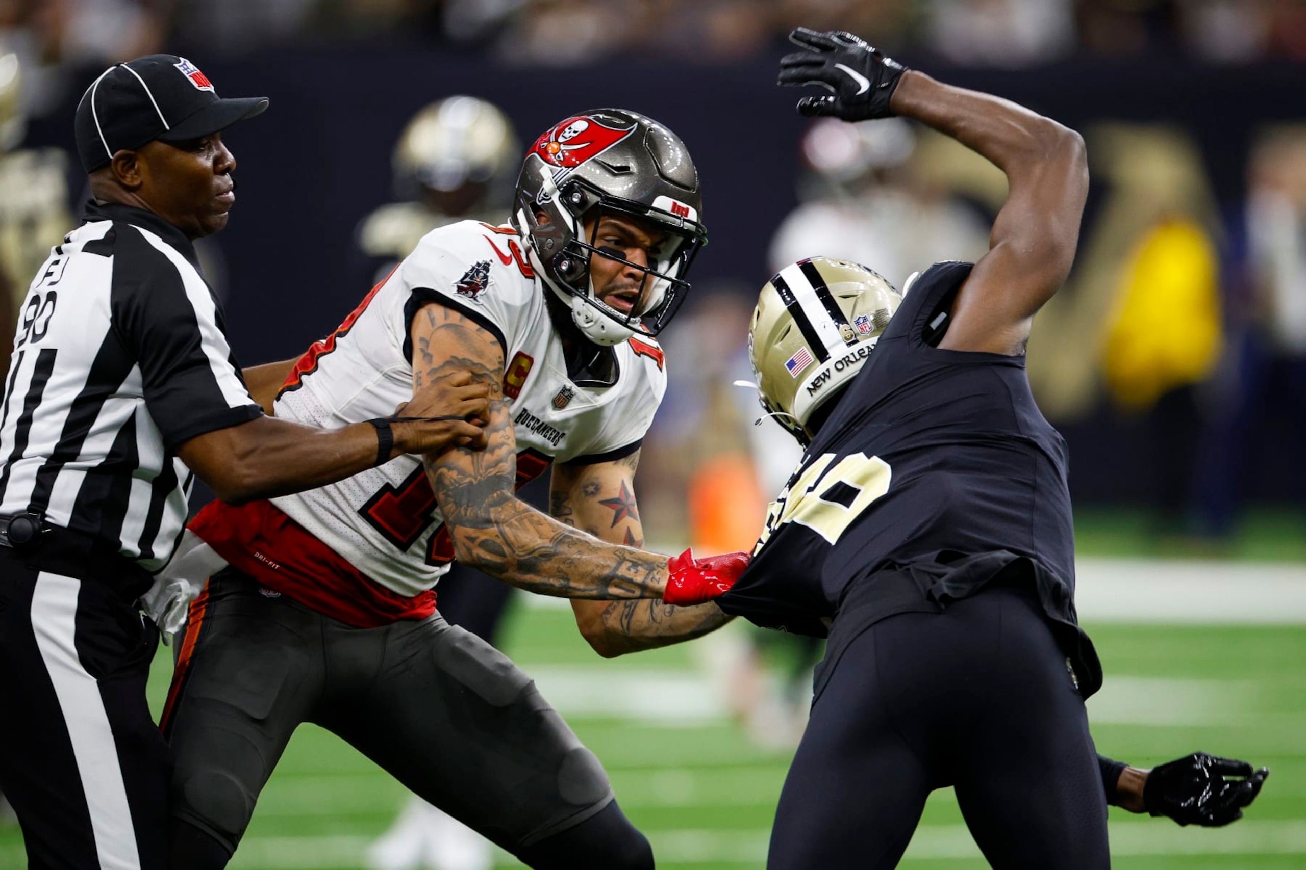 NEW ORLEANS, LOUISIANA - SEPTEMBER 18: Marcus Maye #6 of the New Orleans Saints argues with Mike Evans #13 of the Tampa Bay Buccaneers on the field during the second half of the game at Caesars Superdome on September 18, 2022 in New Orleans, Louisiana. (Photo by Chris Graythen/Getty Images)