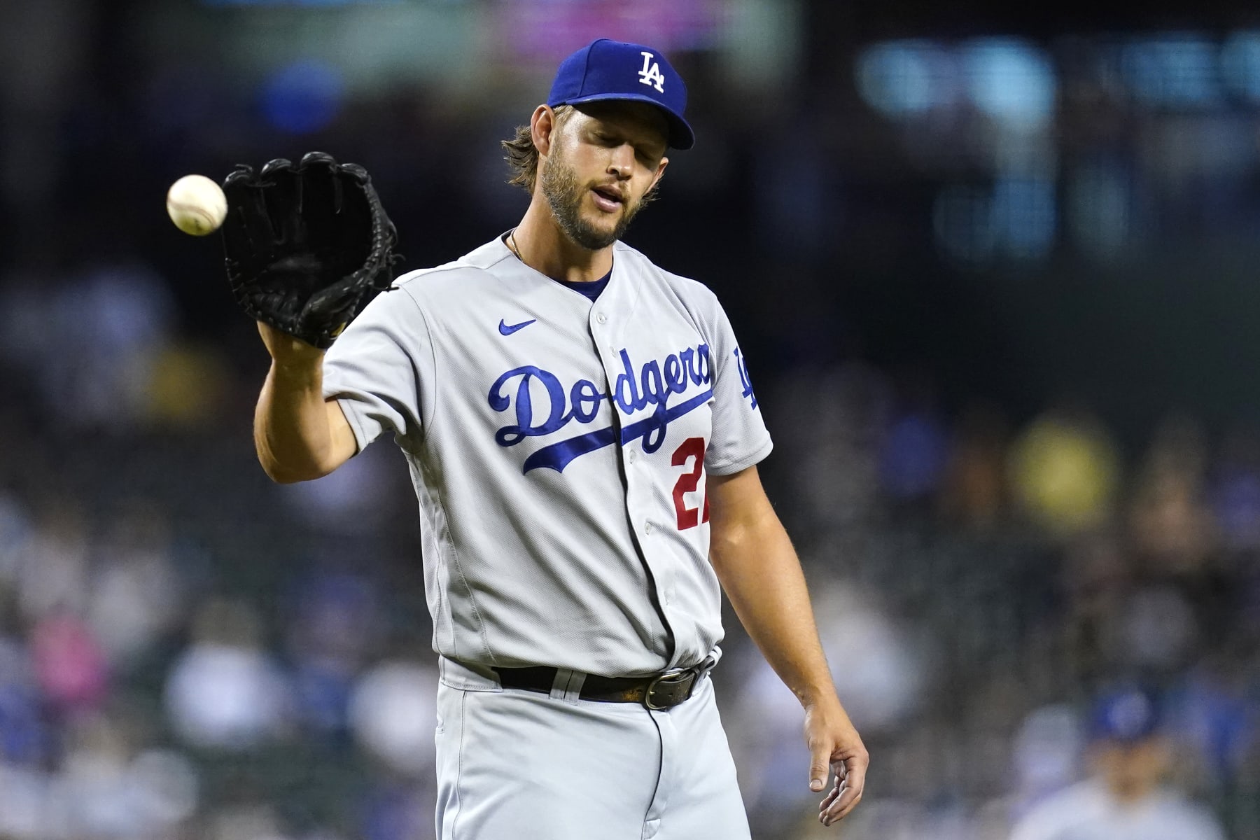 Los Angeles Dodgers starting pitcher Clayton Kershaw gets the ball back during the first inning of a baseball game against the Arizona Diamondbacks in Phoenix, Tuesday, Sept. 13, 2022. (AP Photo/Ross D. Franklin)