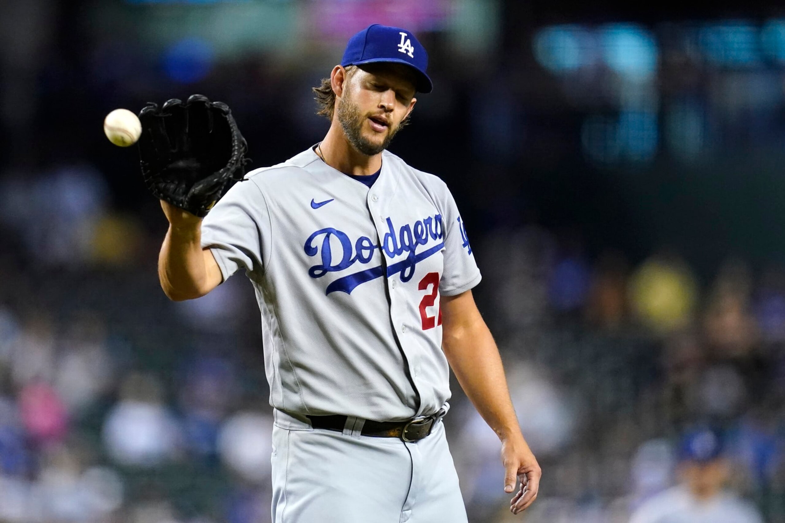 Los Angeles Dodgers starting pitcher Clayton Kershaw gets the ball back during the first inning of a baseball game against the Arizona Diamondbacks in Phoenix, Tuesday, Sept. 13, 2022. (AP Photo/Ross D. Franklin)