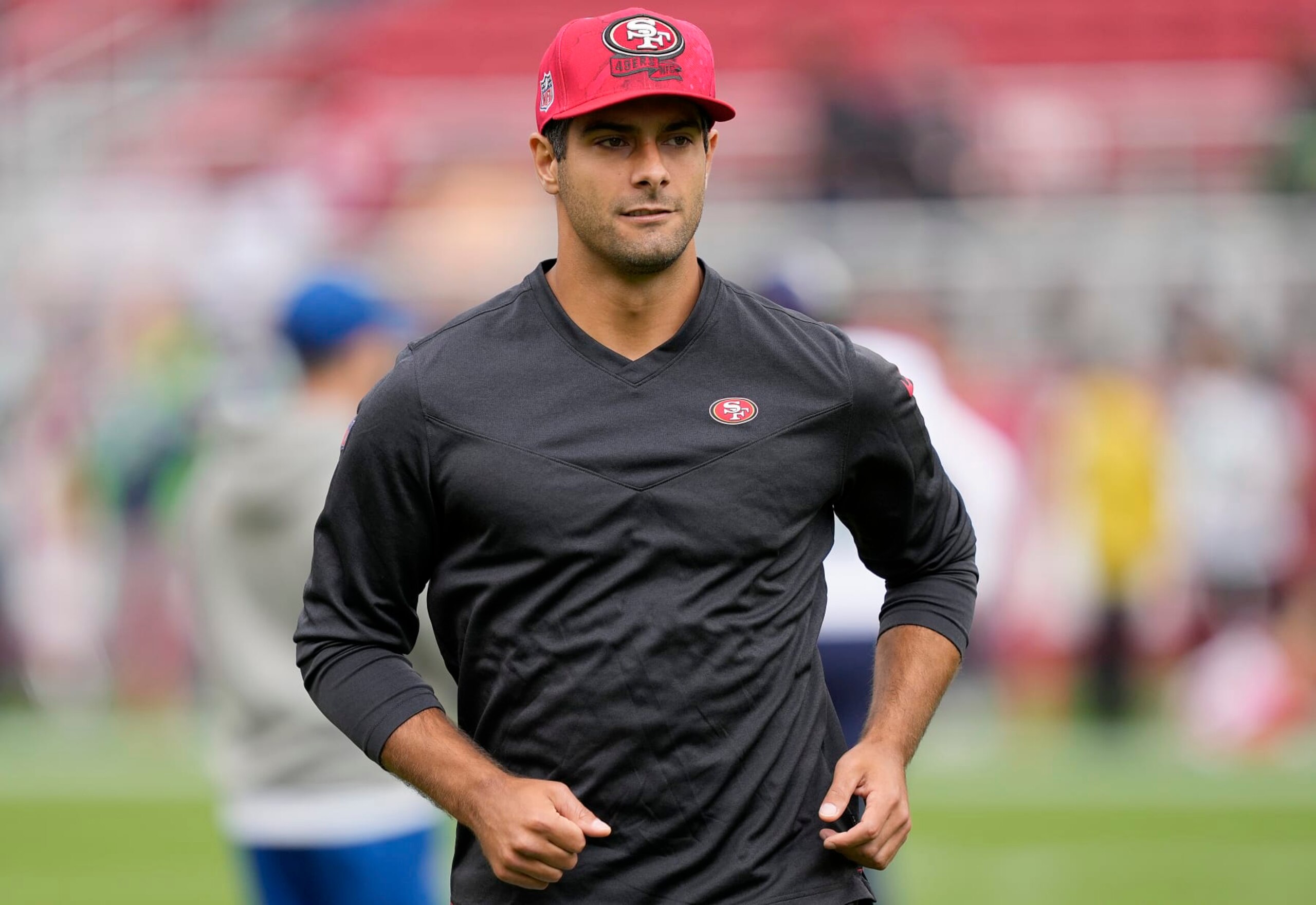 SANTA CLARA, CALIFORNIA - SEPTEMBER 18: Jimmy Garoppolo #10 of the San Francisco 49ers warms up before the game against the Seattle Seahawks at Levi's Stadium on September 18, 2022 in Santa Clara, California. (Photo by Thearon W. Henderson/Getty Images)