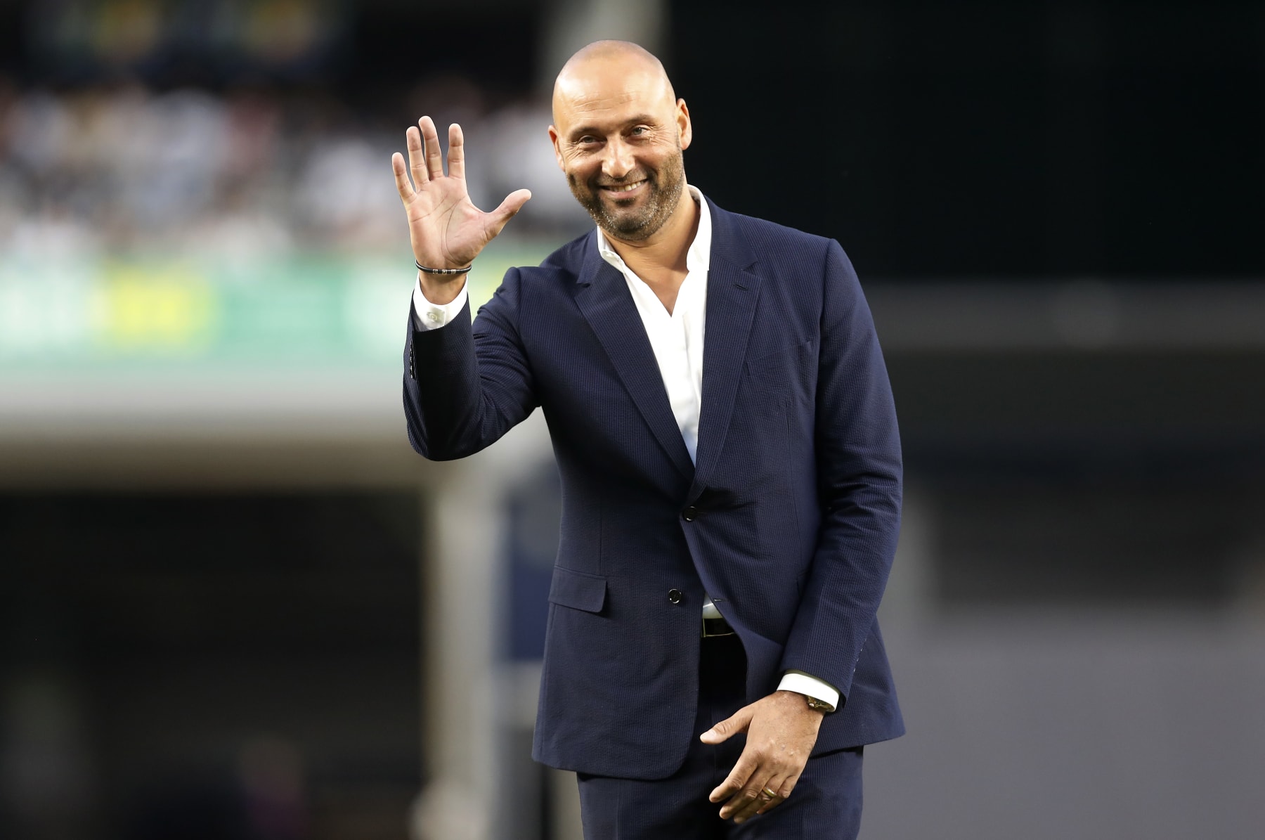 NEW YORK, NEW YORK - SEPTEMBER 09: Baseball Hall of famer Derek Jeter waves to the fans as he is honored by the New York Yankees before a game against the Tampa Bay Rays at Yankee Stadium on September 09, 2022 in the Bronx borough of New York City. (Photo by Jim McIsaac/Getty Images)