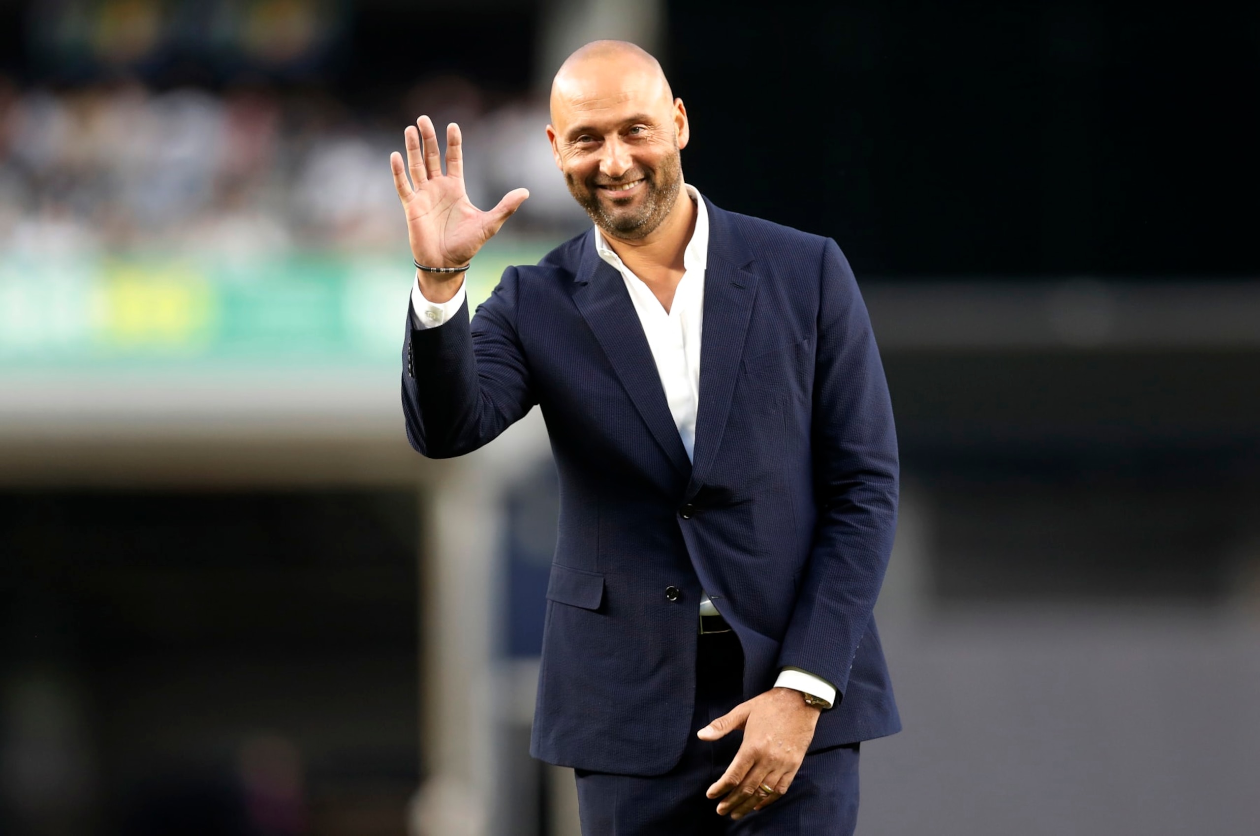 NEW YORK, NEW YORK - SEPTEMBER 09: Baseball Hall of famer Derek Jeter waves to the fans as he is honored by the New York Yankees before a game against the Tampa Bay Rays at Yankee Stadium on September 09, 2022 in the Bronx borough of New York City. (Photo by Jim McIsaac/Getty Images)