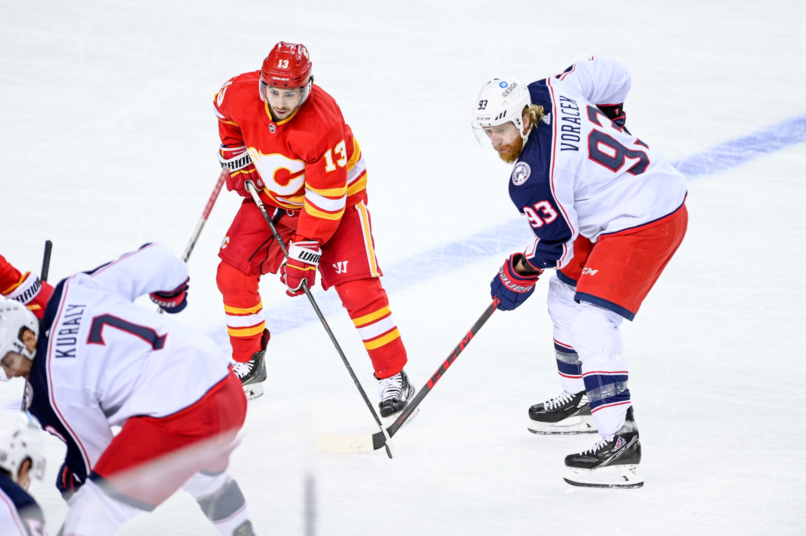 CALGARY, AB - FEBRUARY 15: Calgary Flames Left Wing Johnny Gaudreau (13) and Columbus Blue Jackets Left Wing Jakub Voracek (93) get set for a face-off during the first period of an NHL game where the Calgary Flames hosted the Columbus Blue Jackets on February 15, 2022, at the Scotiabank Saddledome in Calgary, AB. (Photo by Brett Holmes/Icon Sportswire via Getty Images)