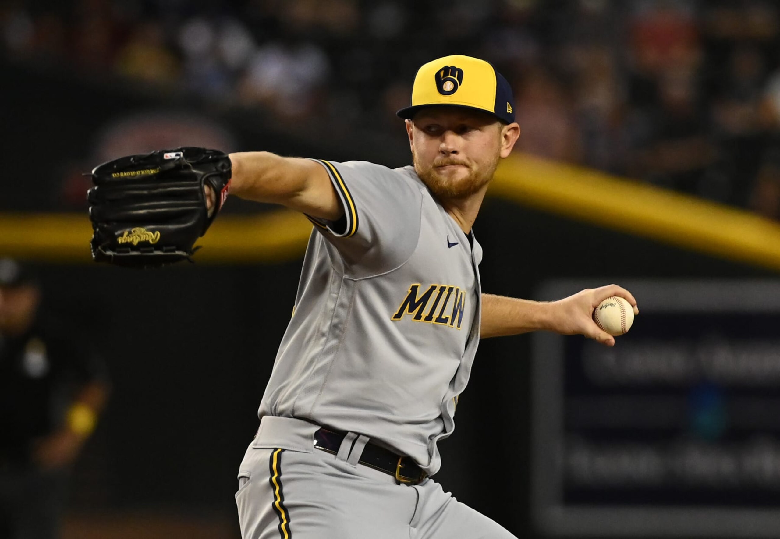 PHOENIX, ARIZONA - SEPTEMBER 02: Eric Lauer #52 of the Milwaukee Brewers delivers a first inning pitch against the Arizona Diamondbacks at Chase Field on September 02, 2022 in Phoenix, Arizona. All MLB teams are wearing gold ribbons on their jerseys and gold wristbands in honor of Childhood Cancer Awareness Day. (Photo by Norm Hall/Getty Images)