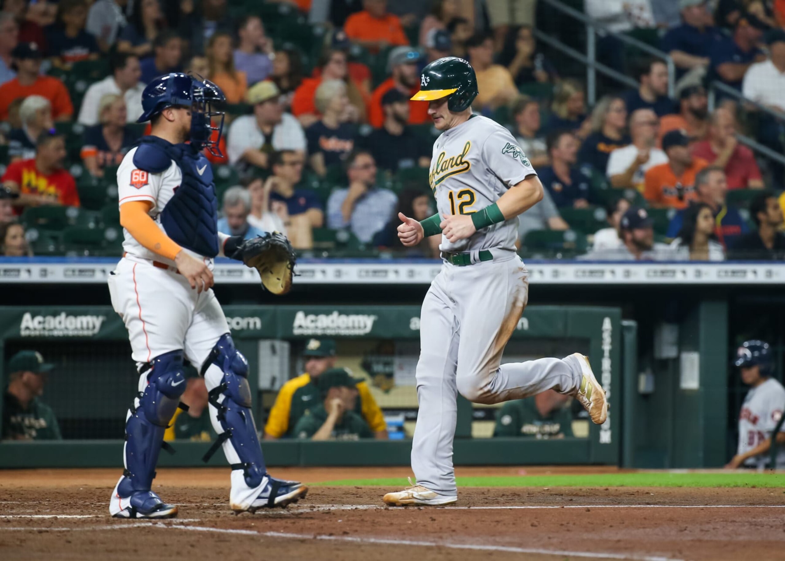 HOUSTON, TX - SEPTEMBER 15:  Oakland Athletics catcher Sean Murphy (12) scores a run in the top of the fourth inning during the MLB game between the Oakland Athletics and Houston Astros on September 15, 2022 at Minute Maid Park in Houston, Texas.  (Photo by Leslie Plaza Johnson/Icon Sportswire via Getty Images)