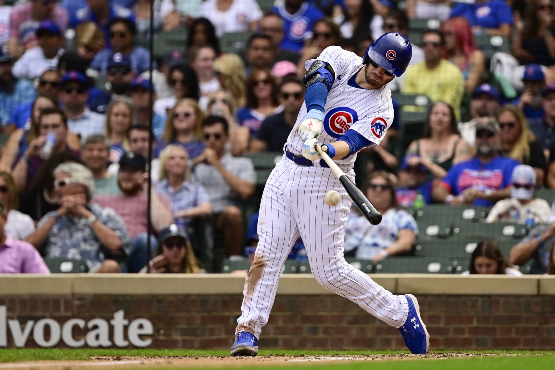 CHICAGO, ILLINOIS - SEPTEMBER 17: Ian Happ #8 of the Chicago Cubs hits a single in the fifth inning against the Colorado Rockies at Wrigley Field on September 17, 2022 in Chicago, Illinois. (Photo by Quinn Harris/Getty Images)