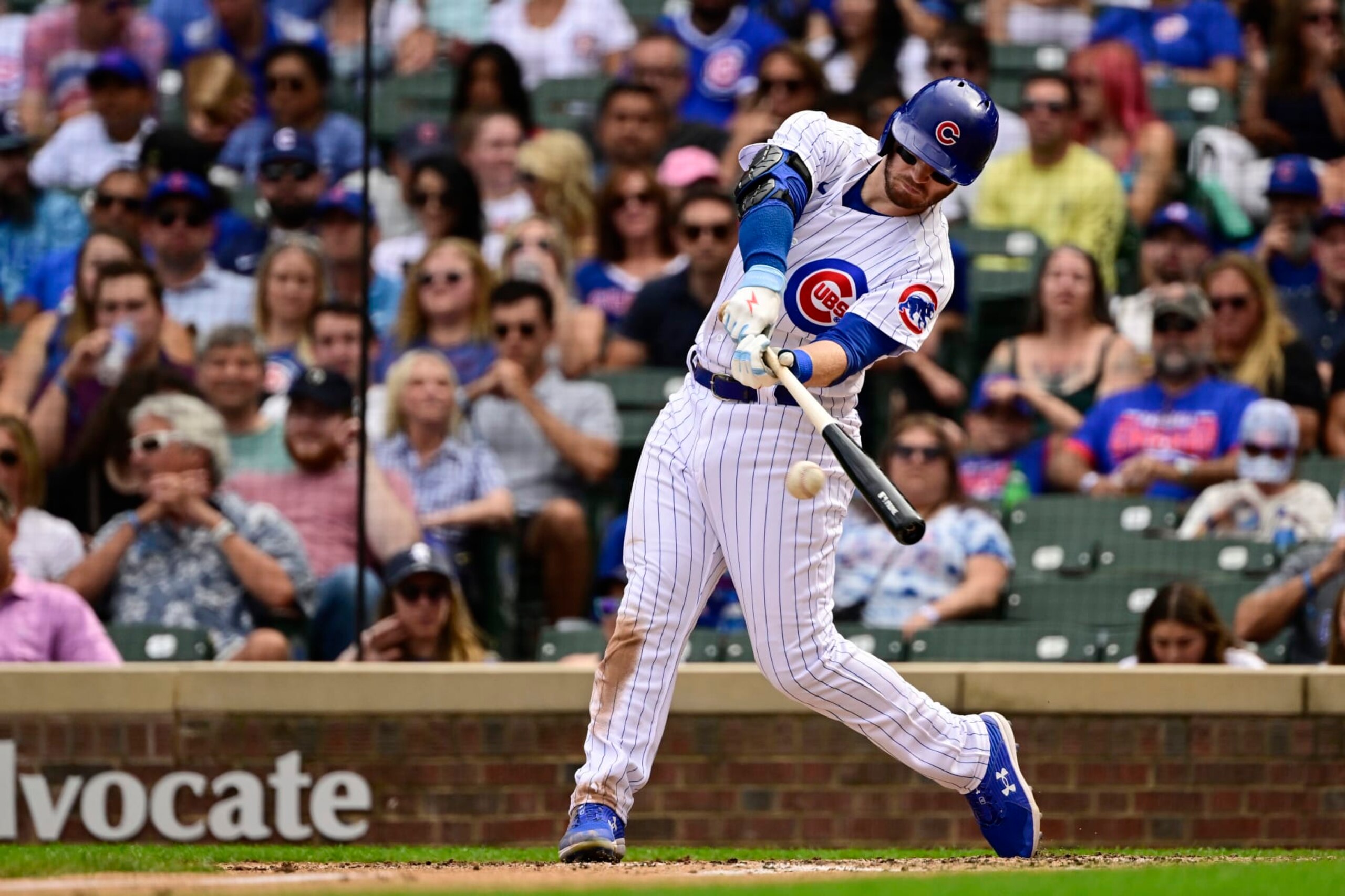 CHICAGO, ILLINOIS - SEPTEMBER 17: Ian Happ #8 of the Chicago Cubs hits a single in the fifth inning against the Colorado Rockies at Wrigley Field on September 17, 2022 in Chicago, Illinois. (Photo by Quinn Harris/Getty Images)