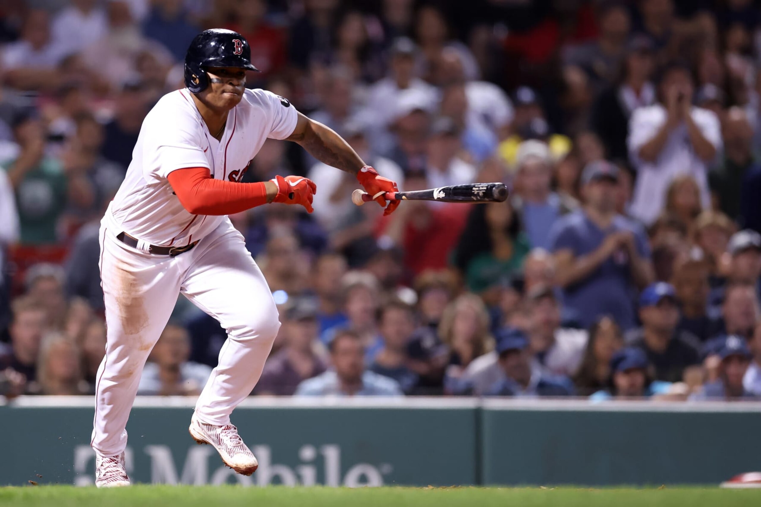 BOSTON, MASSACHUSETTS - SEPTEMBER 14: Rafael Devers #11 of the Boston Red Sox runs towards first after hitting a single against the New York Yankees during the eighth inning at Fenway Park on September 14, 2022 in Boston, Massachusetts. (Photo by Maddie Meyer/Getty Images)