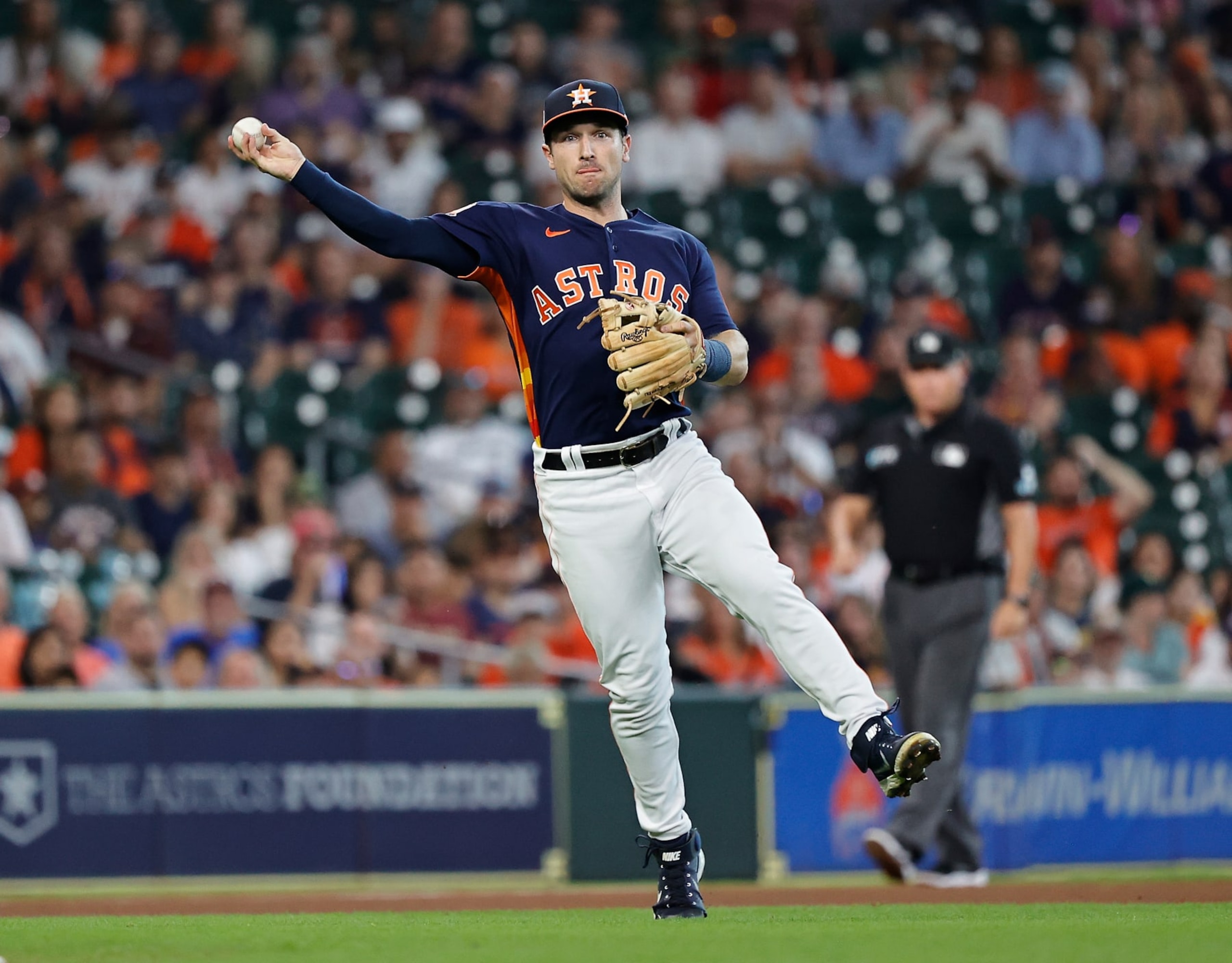 HOUSTON, TEXAS - SEPTEMBER 18: Alex Bregman #2 of the Houston Astros throws out Sean Murphy #12 of the Oakland Athletics in the first inning at Minute Maid Park on September 18, 2022 in Houston, Texas. (Photo by Bob Levey/Getty Images)