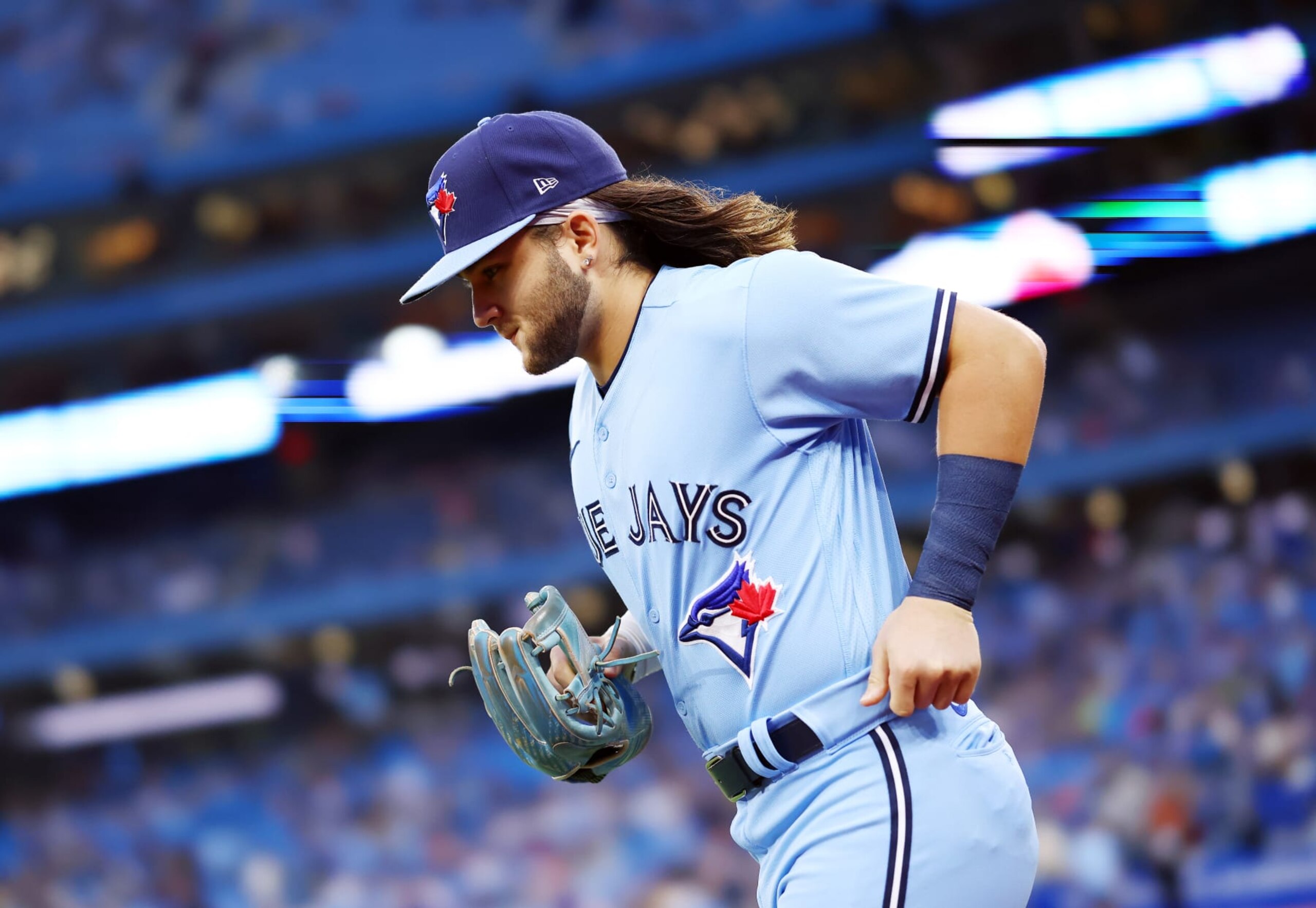 TORONTO, ON - SEPTEMBER 16:  Bo Bichette #11 of the Toronto Blue Jays runs onto the field against the Baltimore Orioles at Rogers Centre on September 16, 2022 in Toronto, Ontario, Canada.  (Photo by Vaughn Ridley/Getty Images)