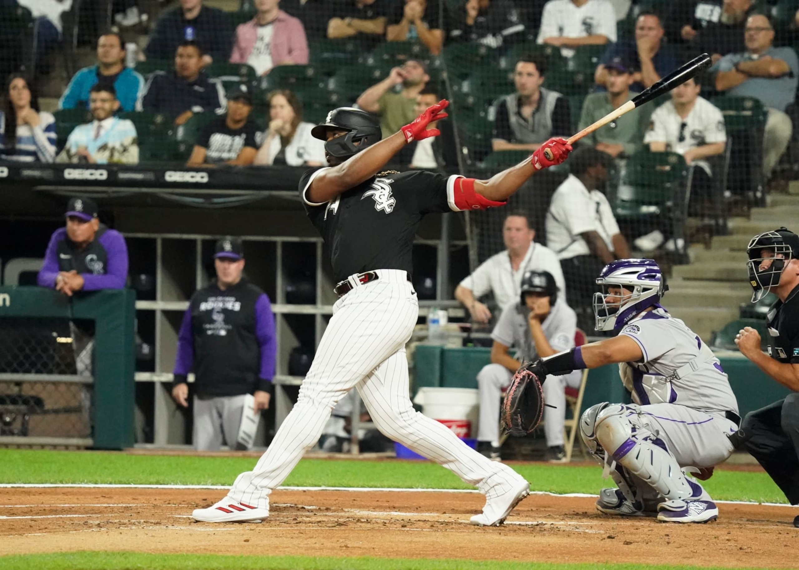 CHICAGO, ILLINOIS - SEPTEMBER 13: Eloy Jimenez #74 of the Chicago White Sox hits a three-run home run during the first inning of a game against the Colorado Rockies at Guaranteed Rate Field on September 13, 2022 in Chicago, Illinois. (Photo by Nuccio DiNuzzo/Getty Images)