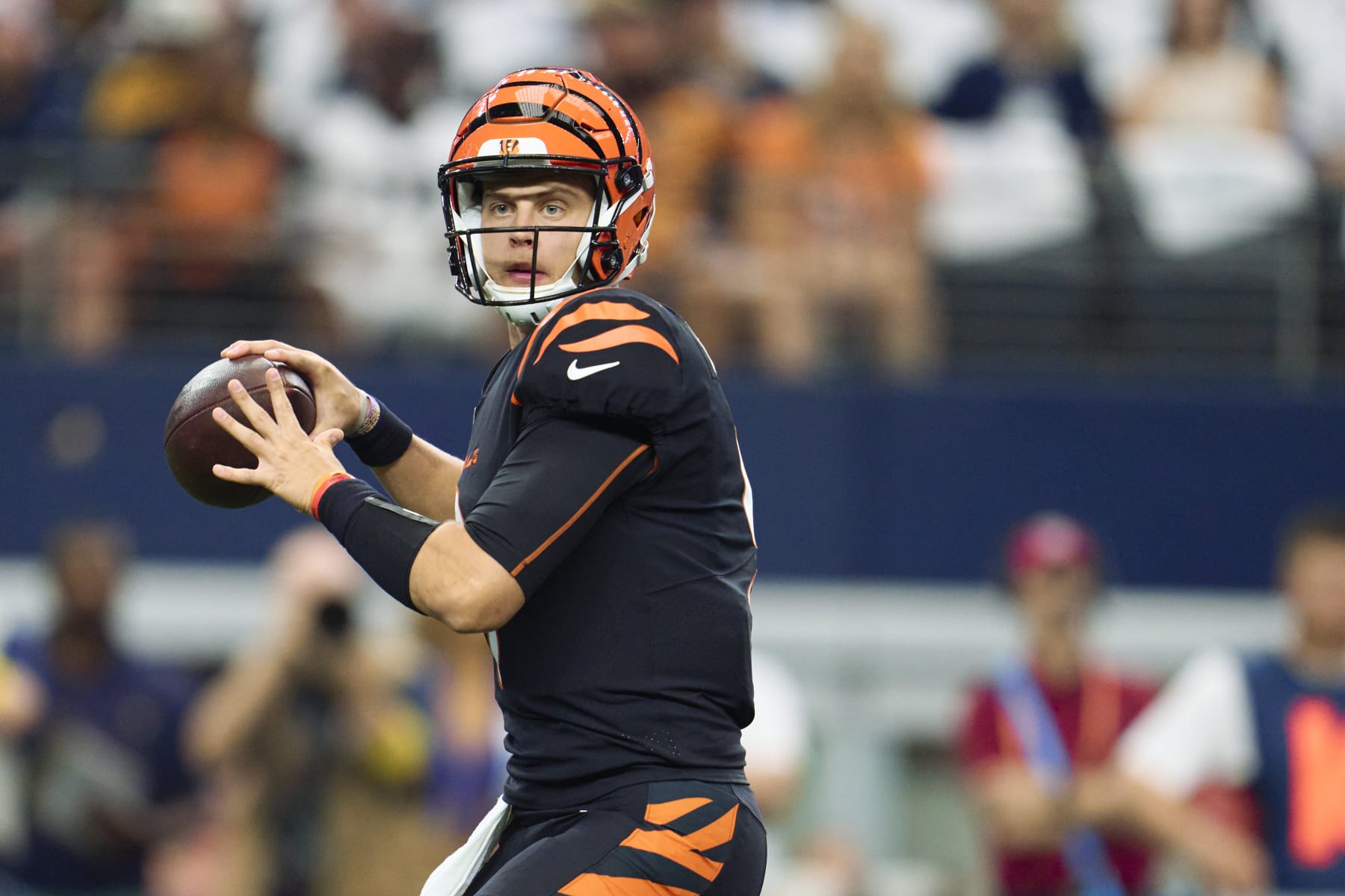 ARLINGTON, TX - SEPTEMBER 18: Joe Burrow #9 of the Cincinnati Bengals drops back to pass against the Dallas Cowboys at AT&T Stadium on September 18, 2022 in Arlington, Texas. (Photo by Cooper Neill/Getty Images)
