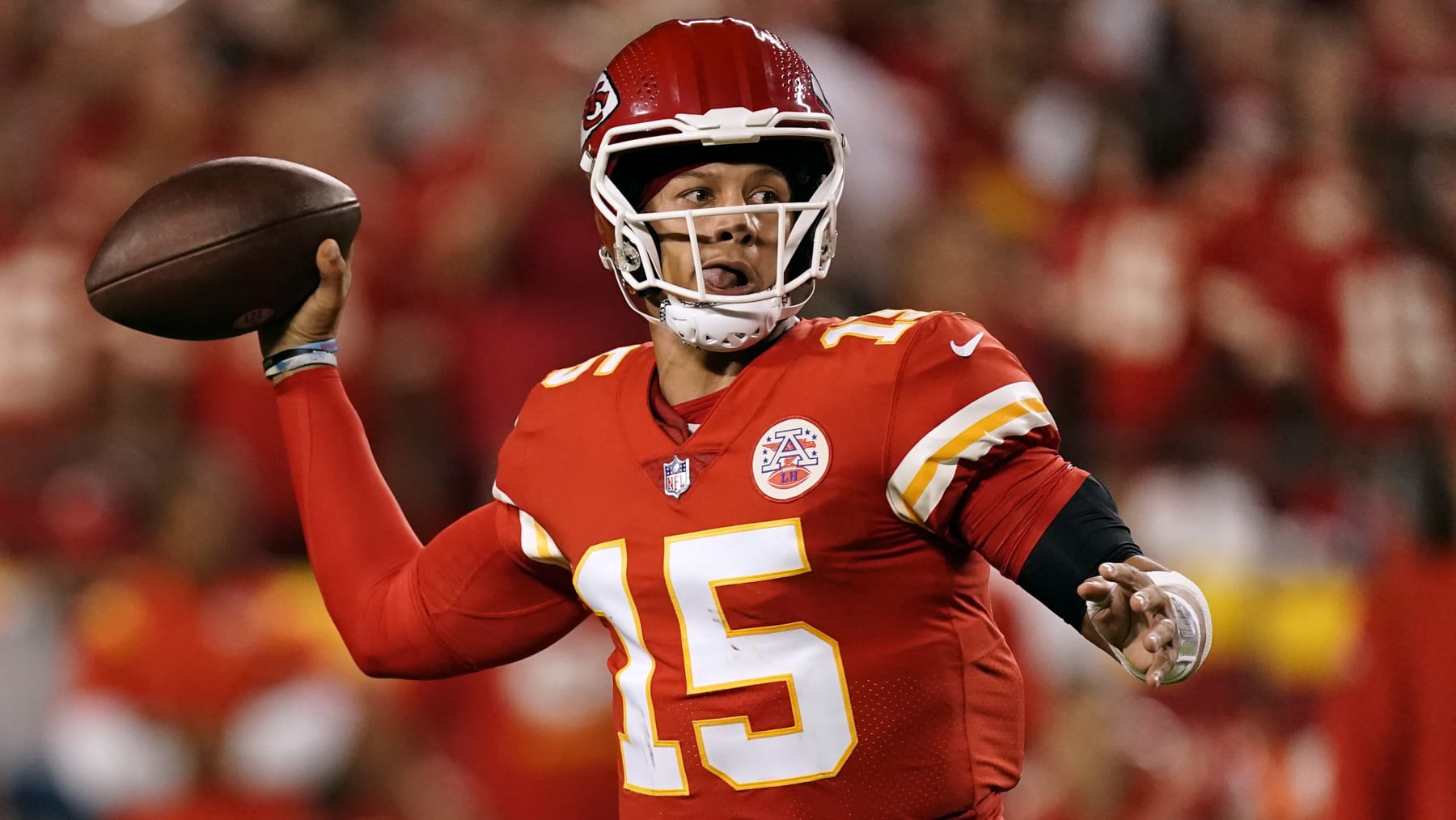 Kansas City Chiefs quarterback Patrick Mahomes looks to pass during the second half of an NFL football game against the Los Angeles Chargers Thursday, Sept. 15, 2022, in Kansas City, Mo. (AP Photo/Charlie Riedel)