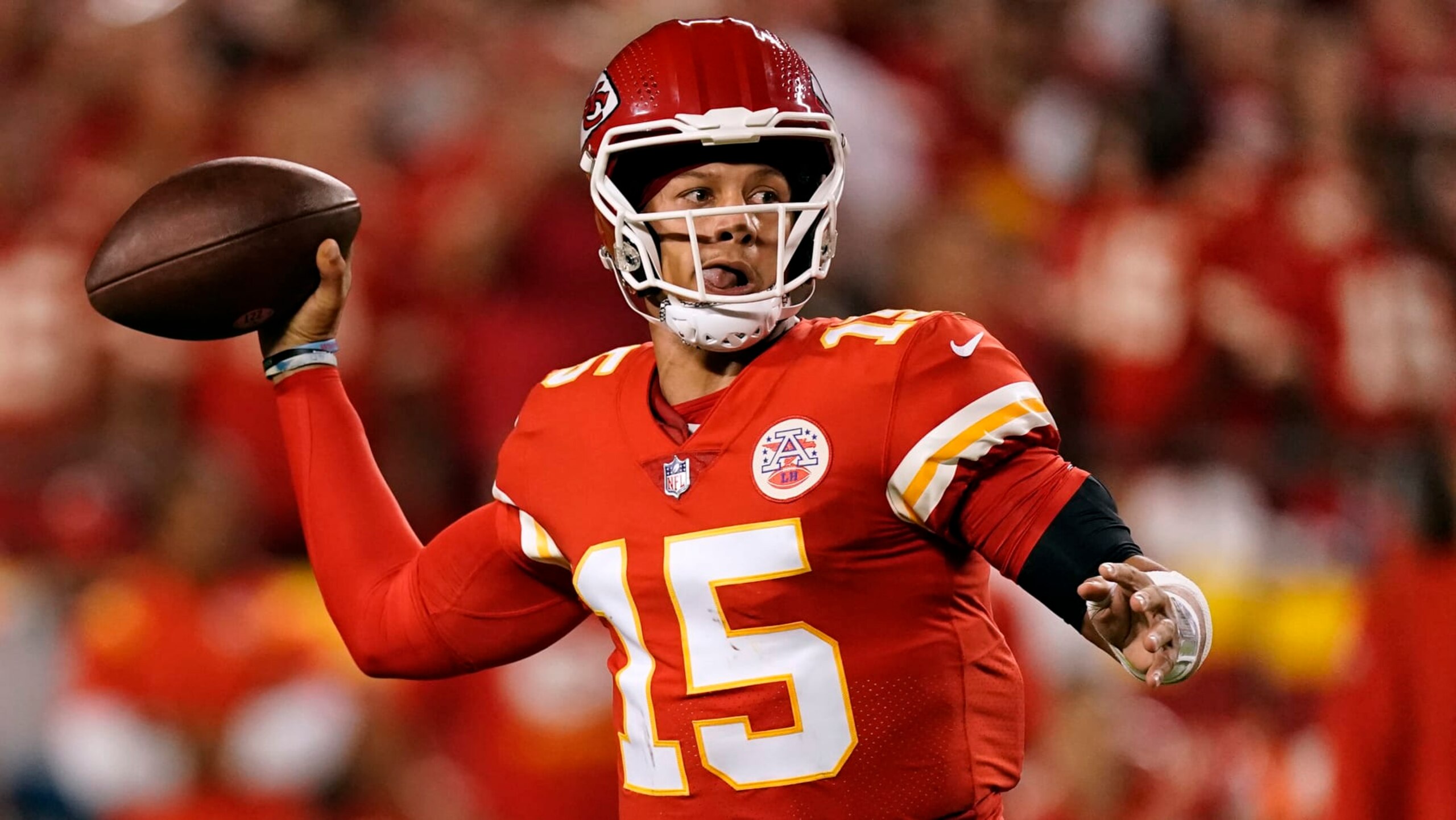 Kansas City Chiefs quarterback Patrick Mahomes looks to pass during the second half of an NFL football game against the Los Angeles Chargers Thursday, Sept. 15, 2022, in Kansas City, Mo. (AP Photo/Charlie Riedel)