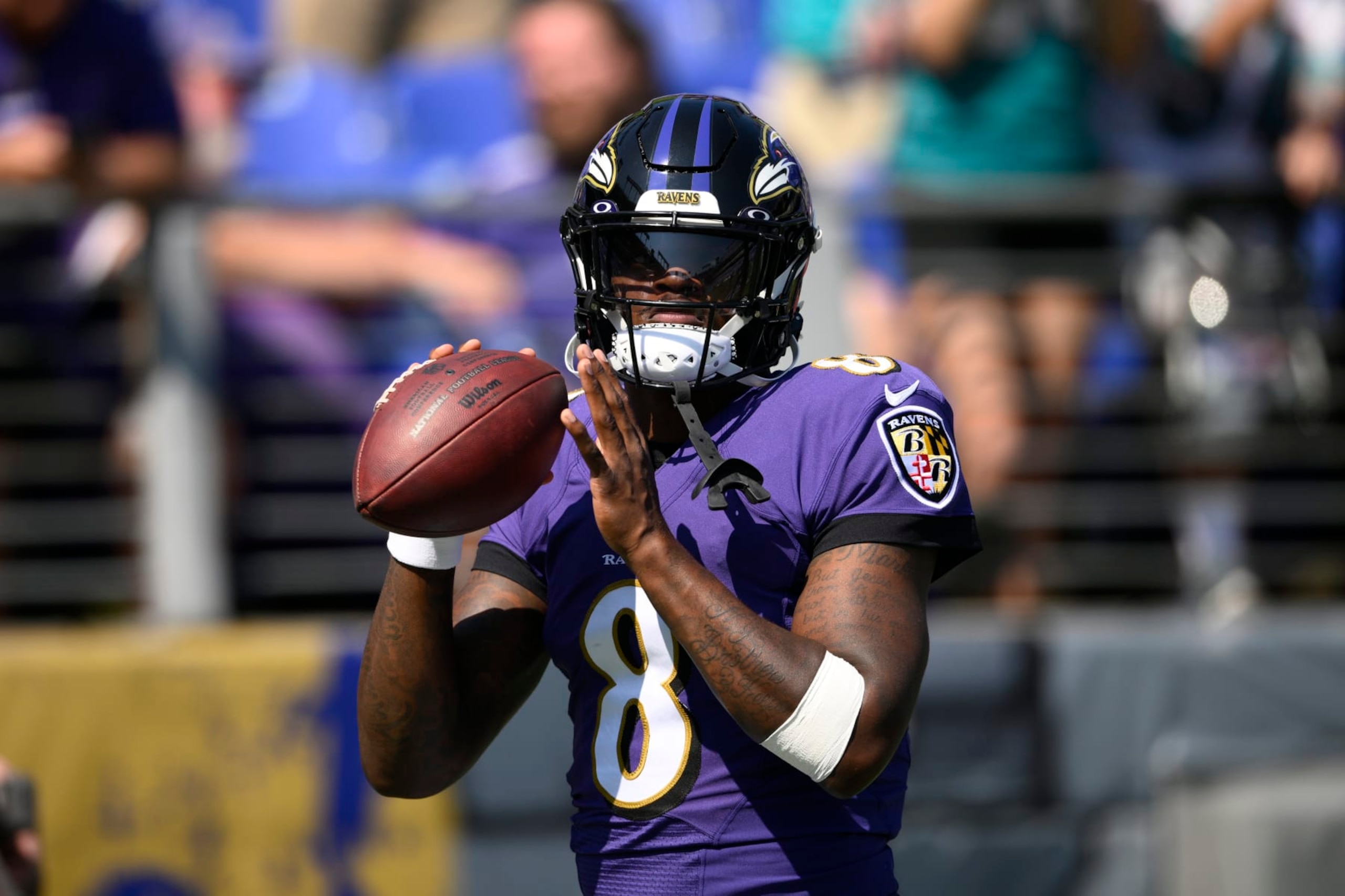 Baltimore Ravens quarterback Lamar Jackson (8) warms up prior to an NFL football game against the Miami Dolphins, Sunday, Sept. 18, 2022, in Baltimore. (AP Photo/Nick Wass)