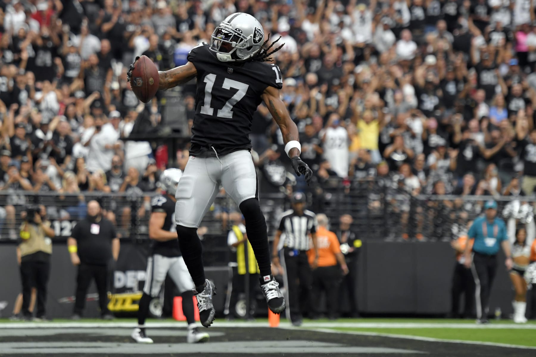 Las Vegas Raiders wide receiver Davante Adams (17) celebrates after a touchdown reception during the first half of an NFL football game against the Arizona Cardinals Sunday, Sept. 18, 2022, in Las Vegas. (AP Photo/David Becker)