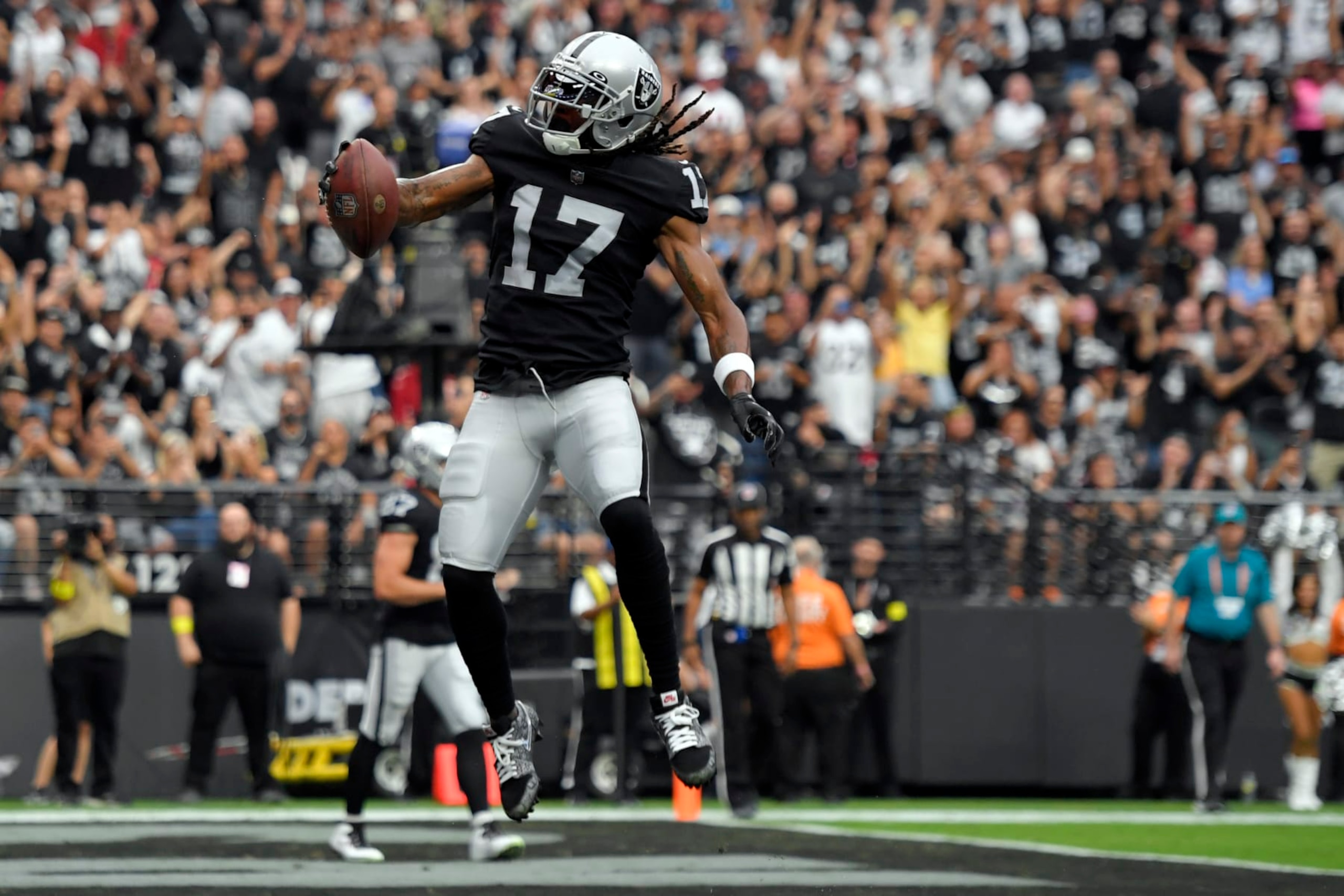 Las Vegas Raiders wide receiver Davante Adams (17) celebrates after a touchdown reception during the first half of an NFL football game against the Arizona Cardinals Sunday, Sept. 18, 2022, in Las Vegas. (AP Photo/David Becker)