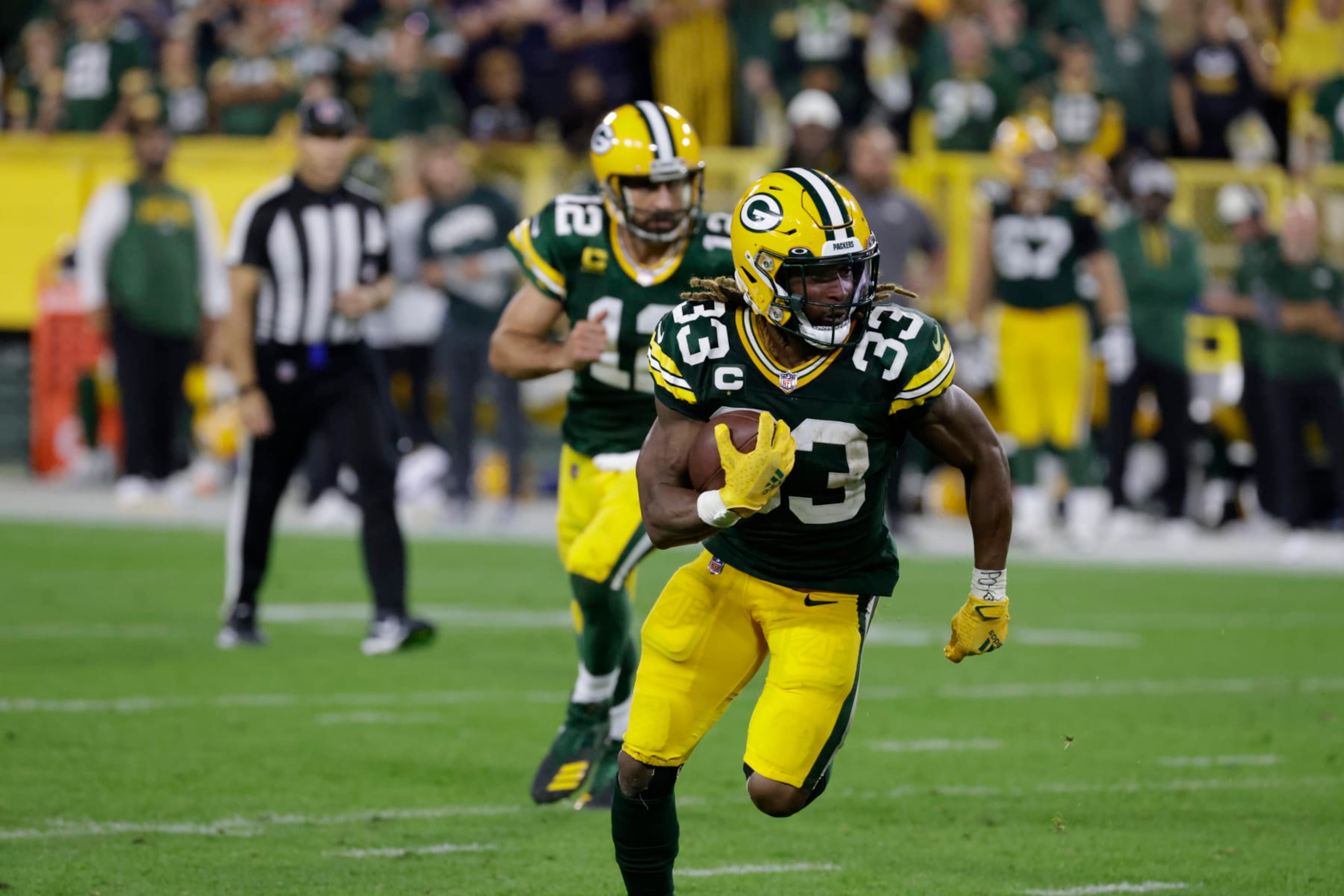 Green Bay Packers running back Aaron Jones (33) during an NFL football game between the Packers and Bears Sunday, Sept. 18, 2022, in Green Bay, Wis. (AP Photo/Mike Roemer) Green Bay Packers running back Aaron Jones (33) during an NFL football game between the Packers and Bears Sunday, Sept. 18, 2022, in Green Bay, Wis. (AP Photo/Mike Roemer)