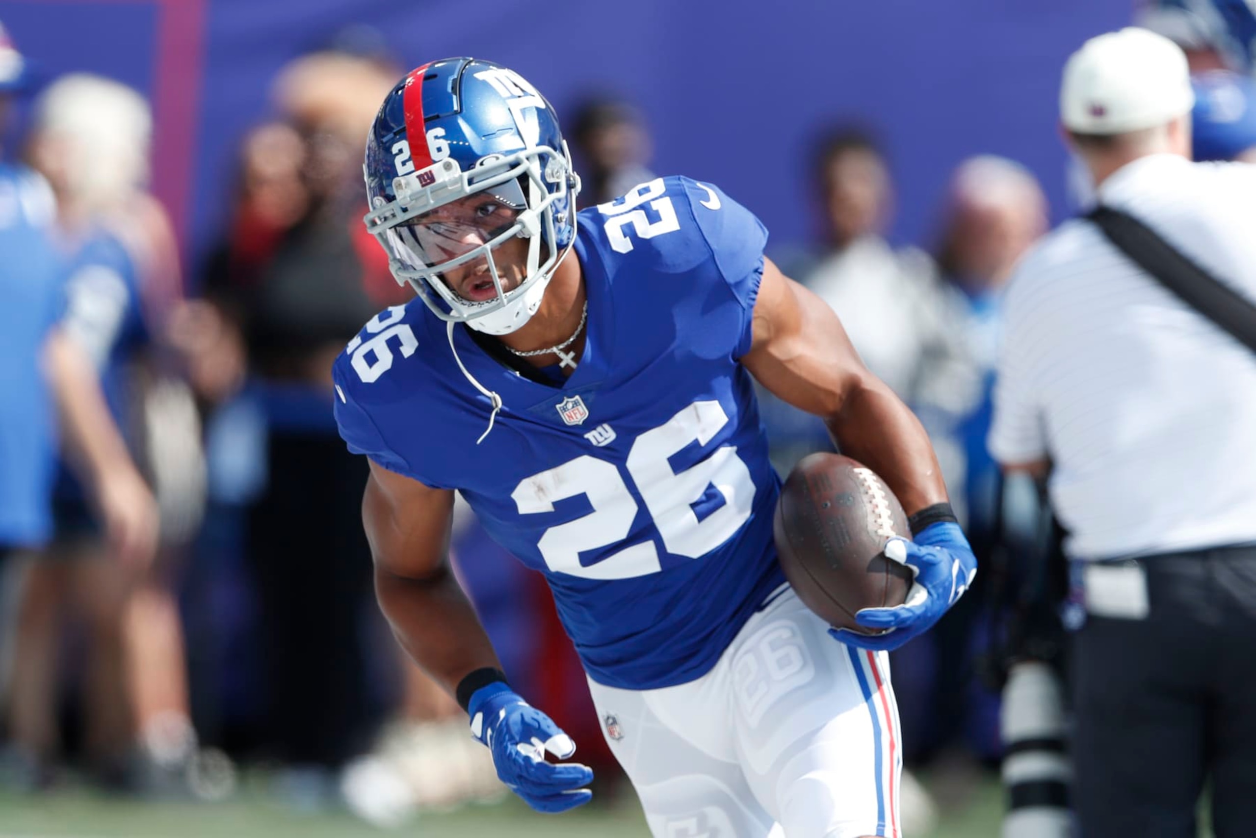 New York Giants' Saquon Barkley warms-up before an NFL football game against the Carolina Panthers, Sunday, Sept. 18, 2022, in East Rutherford, N.J. (AP Photo/Noah K. Murray)
