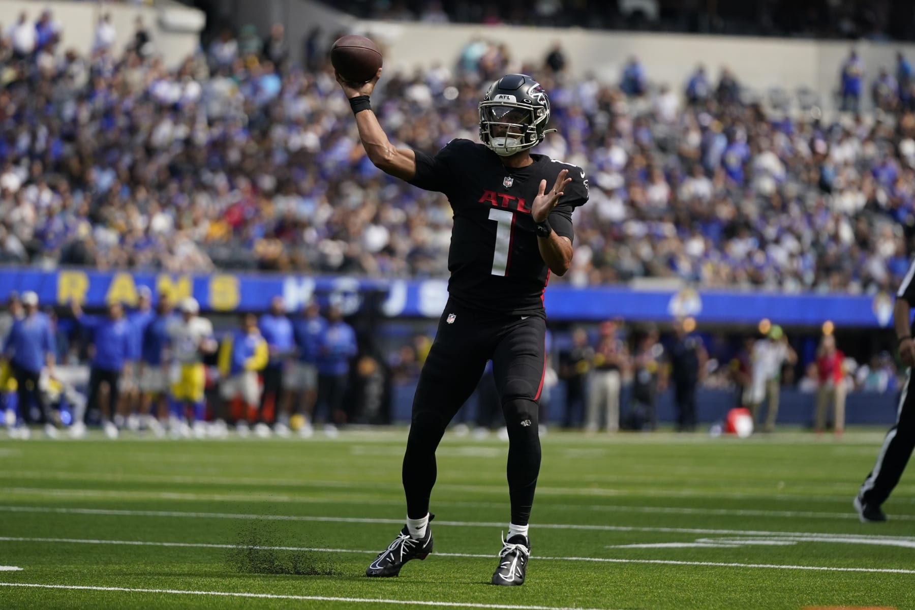 Atlanta Falcons quarterback Marcus Mariota throws passes during the first half of an NFL football game against the Los Angeles Rams, Sunday, Sept. 18, 2022, in Inglewood, Calif. (AP Photo/Ashley Landis)