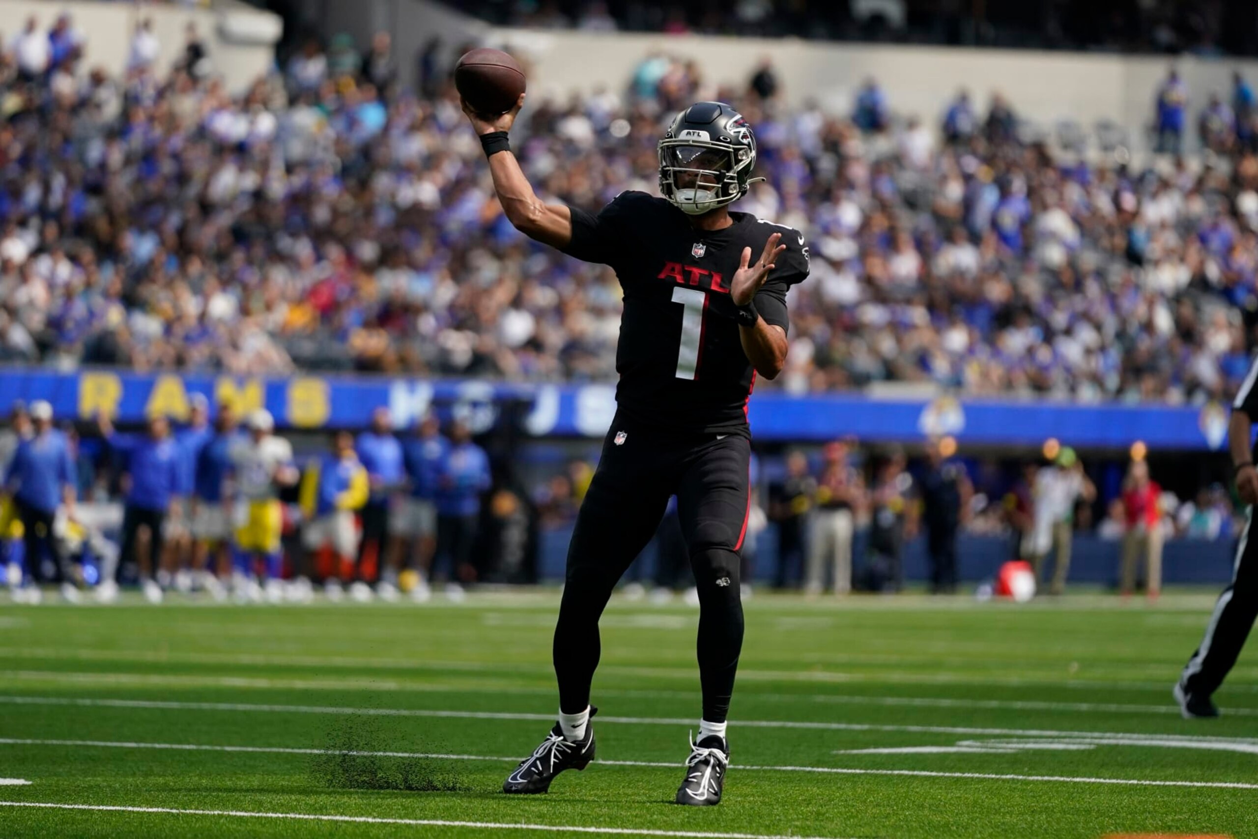 Atlanta Falcons quarterback Marcus Mariota throws passes during the first half of an NFL football game against the Los Angeles Rams, Sunday, Sept. 18, 2022, in Inglewood, Calif. (AP Photo/Ashley Landis)