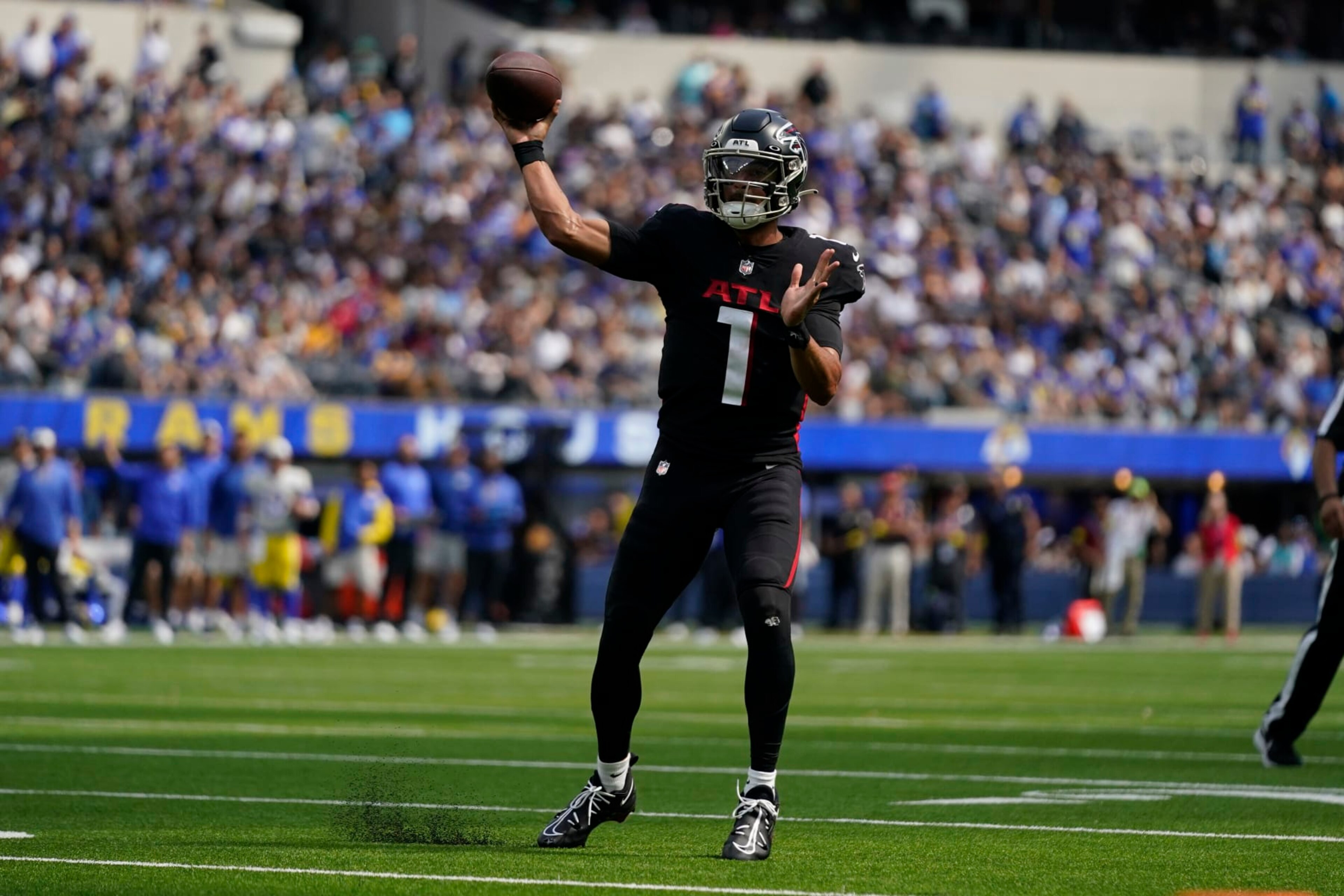 Atlanta Falcons quarterback Marcus Mariota throws passes during the first half of an NFL football game against the Los Angeles Rams, Sunday, Sept. 18, 2022, in Inglewood, Calif. (AP Photo/Ashley Landis)