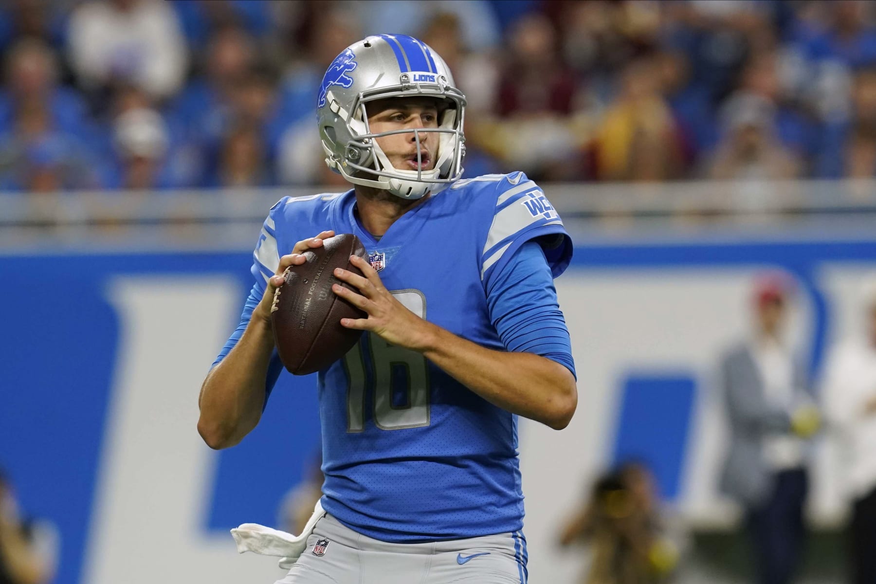 Detroit Lions quarterback Jared Goff (16) looks for a receiver during the first half of an NFL football game against the Washington Commanders Sunday, Sept. 18, 2022, in Detroit. (AP Photo/Paul Sancya)