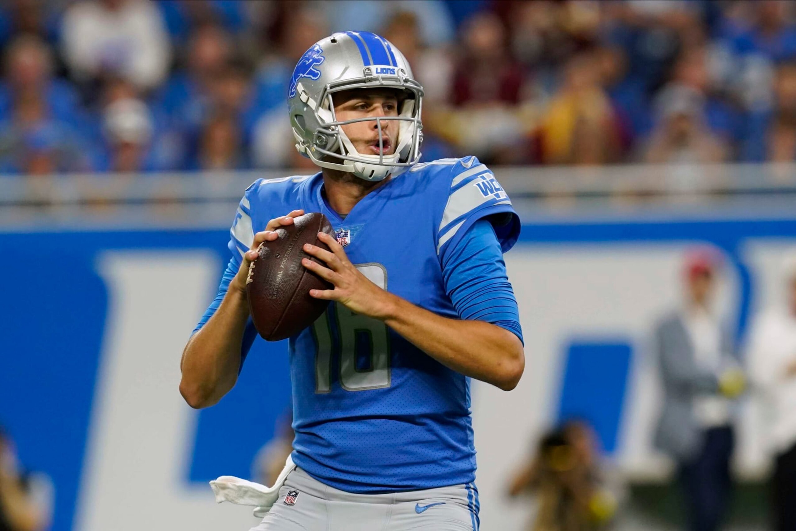 Detroit Lions quarterback Jared Goff (16) looks for a receiver during the first half of an NFL football game against the Washington Commanders Sunday, Sept. 18, 2022, in Detroit. (AP Photo/Paul Sancya)