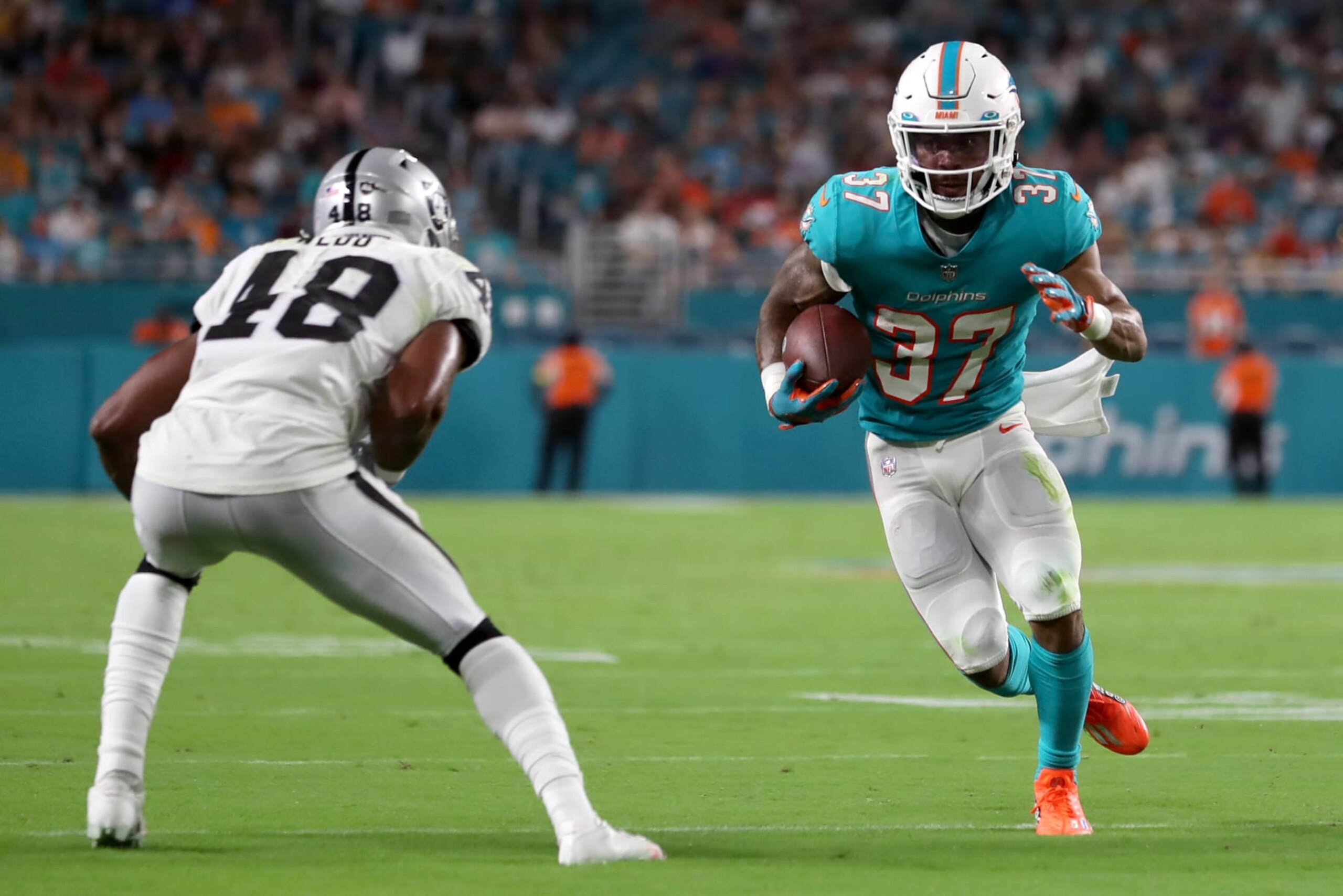 MIAMI GARDENS, FLORIDA - AUGUST 20: Myles Gaskin #37 of the Miami Dolphins carries the ball during the second quarter against the Las Vegas Raiders at Hard Rock Stadium on August 20, 2022 in Miami Gardens, Florida. (Photo by Megan Briggs/Getty Images) MIAMI GARDENS, FLORIDA - AUGUST 20: Myles Gaskin #37 of the Miami Dolphins carries the ball during the second quarter against the Las Vegas Raiders at Hard Rock Stadium on August 20, 2022 in Miami Gardens, Florida. (Photo by Megan Briggs/Getty Images)
