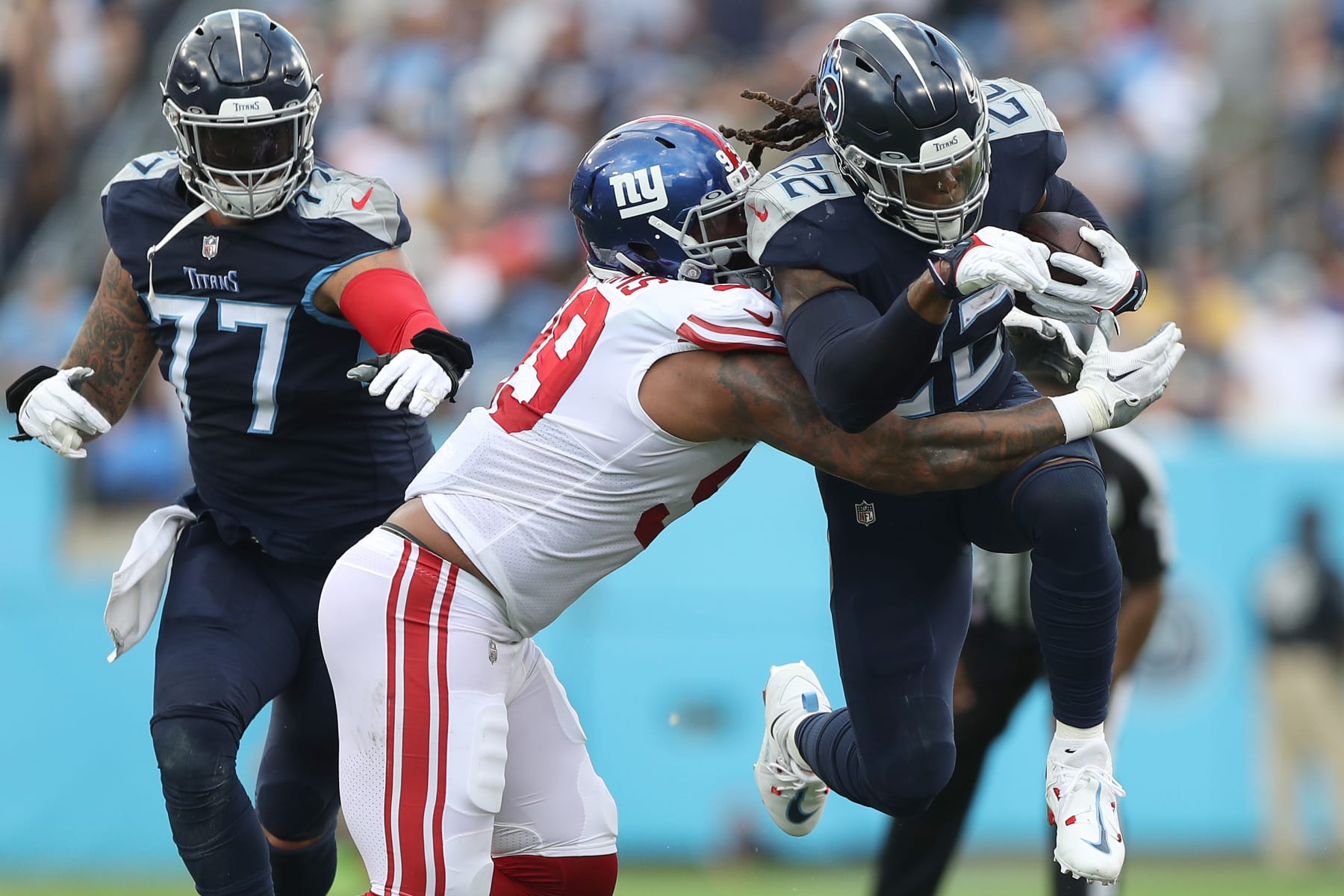 NASHVILLE, TENNESSEE - SEPTEMBER 11: Defensive end Leonard Williams #99 of the New York Giants tackles running back Derrick Henry #22 of the Tennessee Titans during the first half at Nissan Stadium on September 11, 2022 in Nashville, Tennessee. (Photo by Justin Ford/Getty Images)