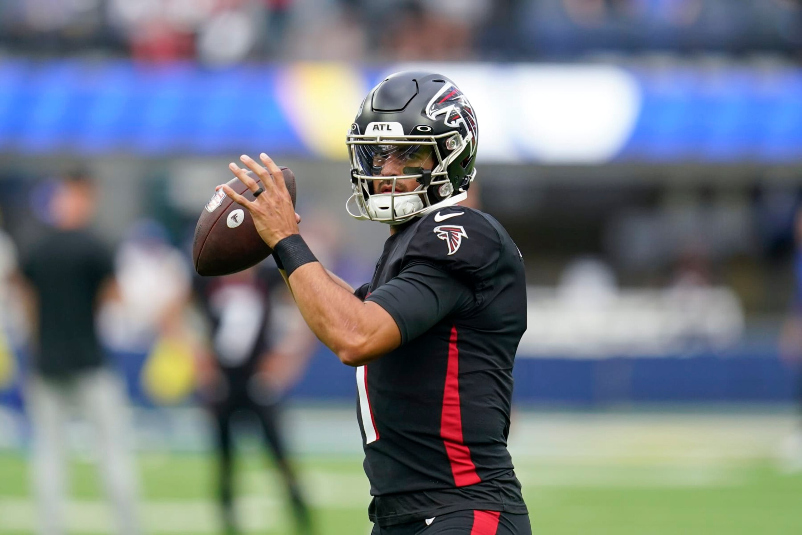 Atlanta Falcons quarterback Marcus Mariota warms up before an NFL football game against the Los Angeles Rams, Sunday, Sept. 18, 2022, in Inglewood, Calif. (AP Photo/Ashley Landis)