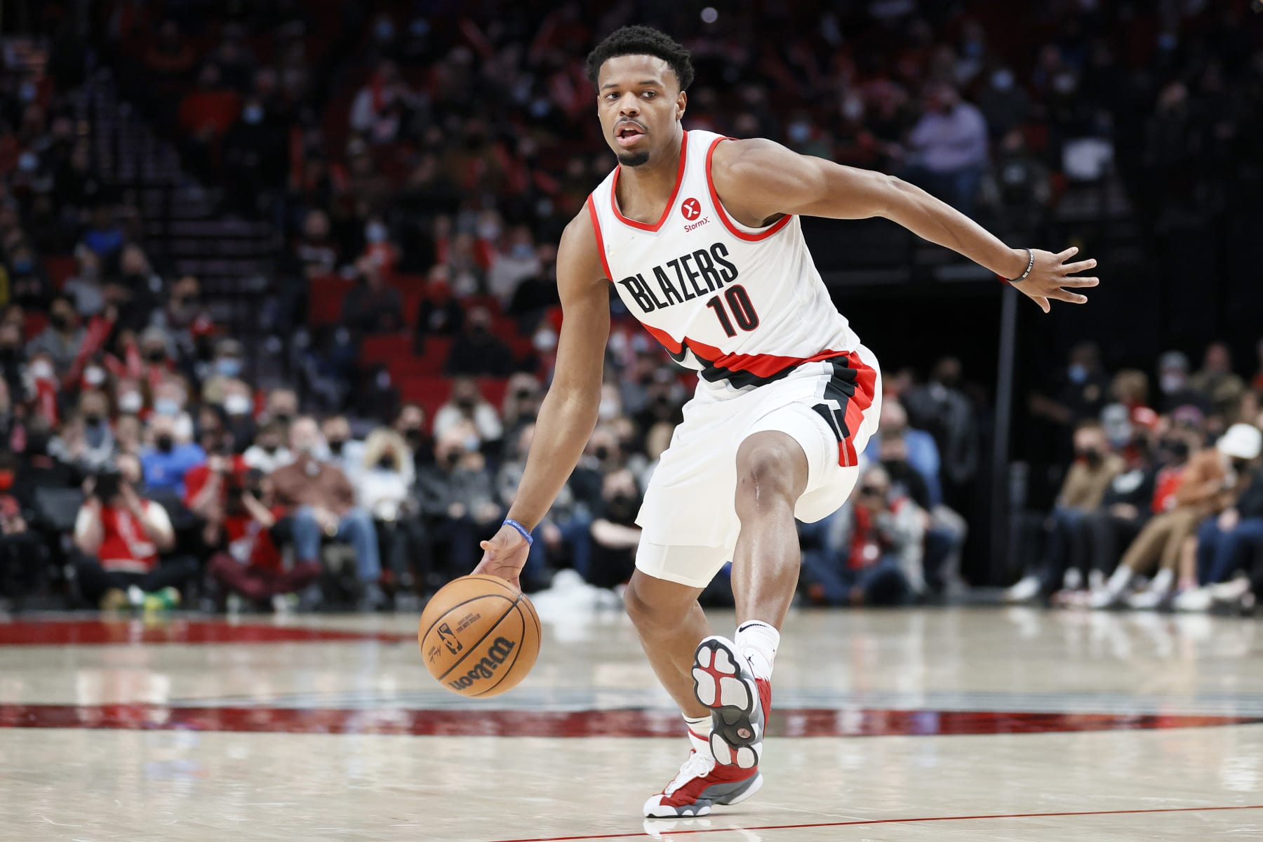 PORTLAND, OREGON - FEBRUARY 08: Dennis Smith Jr. #10 of the Portland Trail Blazers dribbles against the Orlando Magic during the third quarter at Moda Center on February 08, 2022 in Portland, Oregon. NOTE TO USER: User expressly acknowledges and agrees that, by downloading and/or using this photograph, User is consenting to the terms and conditions of the Getty Images License Agreement. (Photo by Steph Chambers/Getty Images) PORTLAND, OREGON - FEBRUARY 08: Dennis Smith Jr. #10 of the Portland Trail Blazers dribbles against the Orlando Magic during the third quarter at Moda Center on February 08, 2022 in Portland, Oregon. NOTE TO USER: User expressly acknowledges and agrees that, by downloading and/or using this photograph, User is consenting to the terms and conditions of the Getty Images License Agreement. (Photo by Steph Chambers/Getty Images)