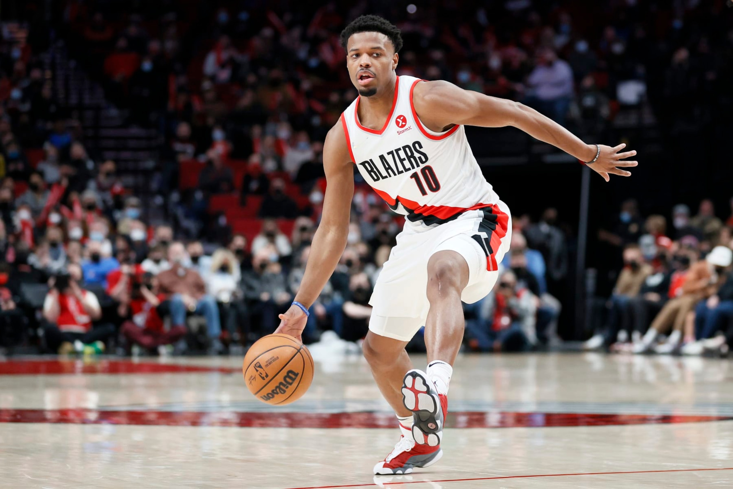 PORTLAND, OREGON - FEBRUARY 08: Dennis Smith Jr. #10 of the Portland Trail Blazers dribbles against the Orlando Magic during the third quarter at Moda Center on February 08, 2022 in Portland, Oregon. NOTE TO USER: User expressly acknowledges and agrees that, by downloading and/or using this photograph, User is consenting to the terms and conditions of the Getty Images License Agreement. (Photo by Steph Chambers/Getty Images) PORTLAND, OREGON - FEBRUARY 08: Dennis Smith Jr. #10 of the Portland Trail Blazers dribbles against the Orlando Magic during the third quarter at Moda Center on February 08, 2022 in Portland, Oregon. NOTE TO USER: User expressly acknowledges and agrees that, by downloading and/or using this photograph, User is consenting to the terms and conditions of the Getty Images License Agreement. (Photo by Steph Chambers/Getty Images)