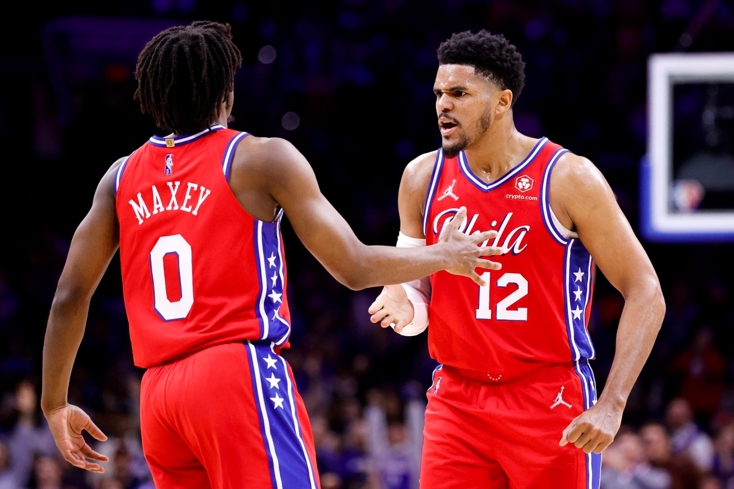 PHILADELPHIA, PENNSYLVANIA - APRIL 18: Tyrese Maxey #0 (L) and Tobias Harris #12 of the Philadelphia 76ers celebrate against the Toronto Raptors during Game Two of the Eastern Conference First Round at Wells Fargo Center on April 18, 2022 in Philadelphia, Pennsylvania. NOTE TO USER: User expressly acknowledges and agrees that, by downloading and or using this photograph, User is consenting to the terms and conditions of the Getty Images License Agreement. (Photo by Tim Nwachukwu/Getty Images)
