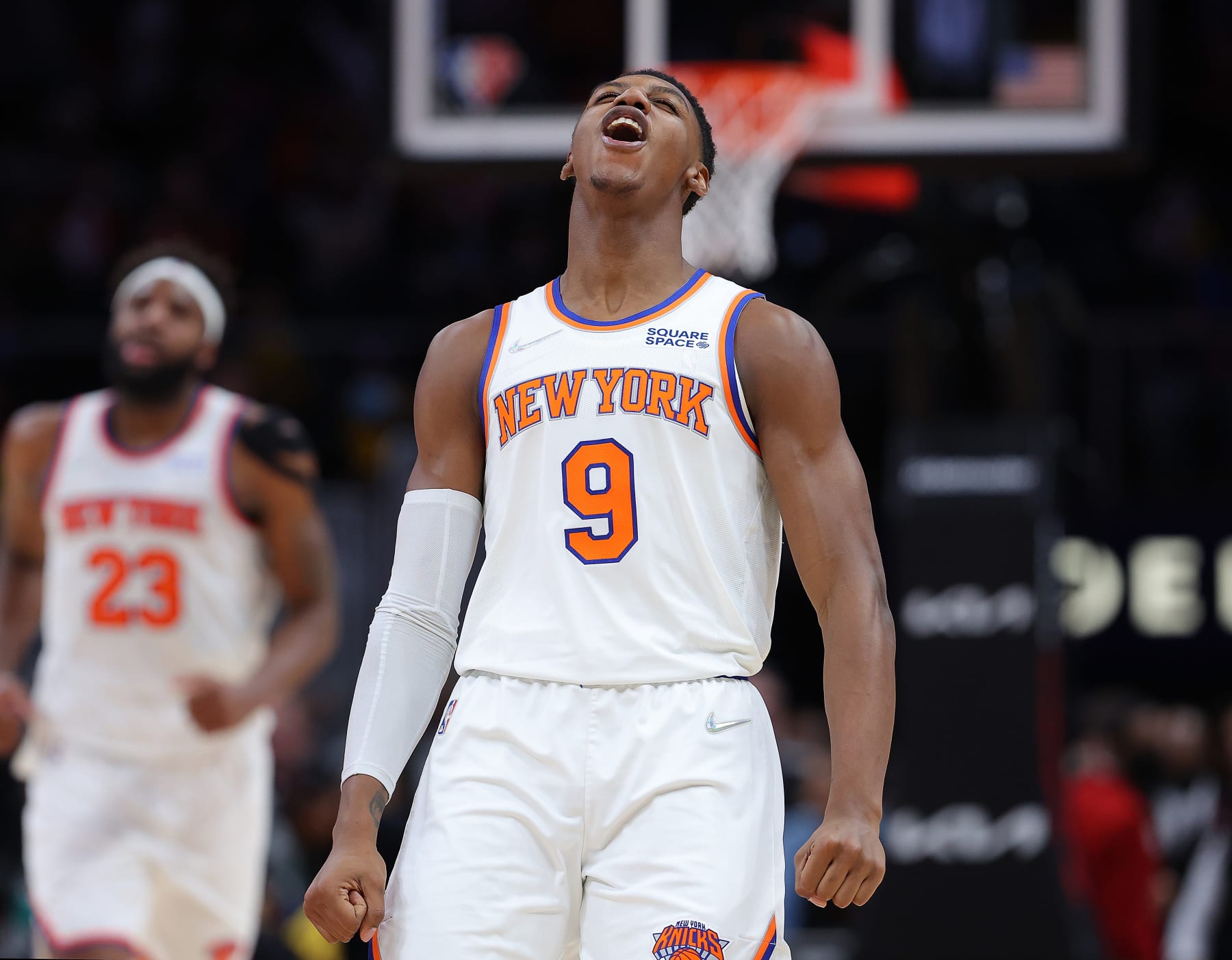 ATLANTA, GEORGIA - JANUARY 15:  RJ Barrett #9 of the New York Knicks reacts after a dunk by Mitchell Robinson #23 against the Atlanta Hawks during the second half at State Farm Arena on January 15, 2022 in Atlanta, Georgia.  NOTE TO USER: User expressly acknowledges and agrees that, by downloading and or using this photograph, User is consenting to the terms and conditions of the Getty Images License Agreement.  (Photo by Kevin C. Cox/Getty Images)