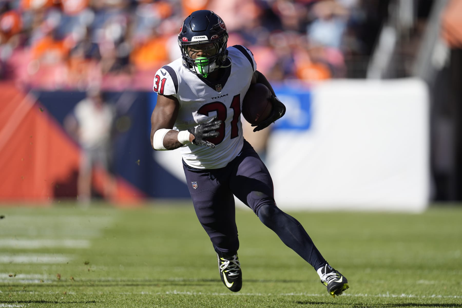 Houston Texans running back Dameon Pierce (31) runs against the Denver Broncos during the second half of an NFL football game, Sunday, Sept. 18, 2022, in Denver. (AP Photo/David Zalubowski)
