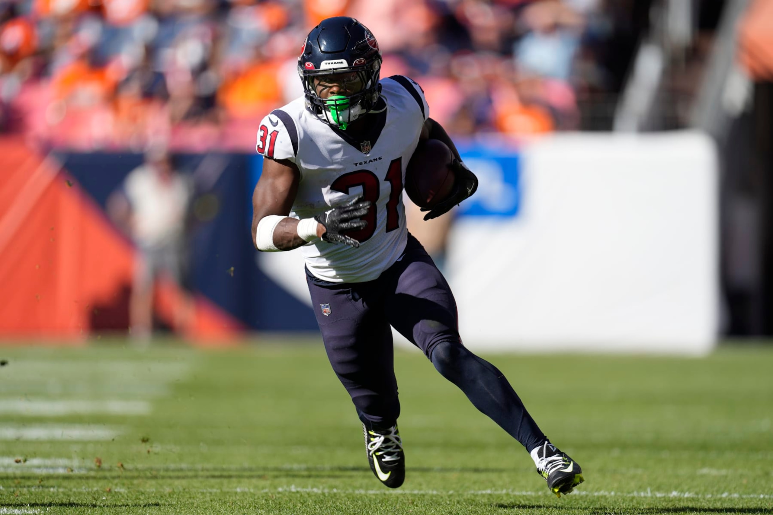Houston Texans running back Dameon Pierce (31) runs against the Denver Broncos during the second half of an NFL football game, Sunday, Sept. 18, 2022, in Denver. (AP Photo/David Zalubowski)