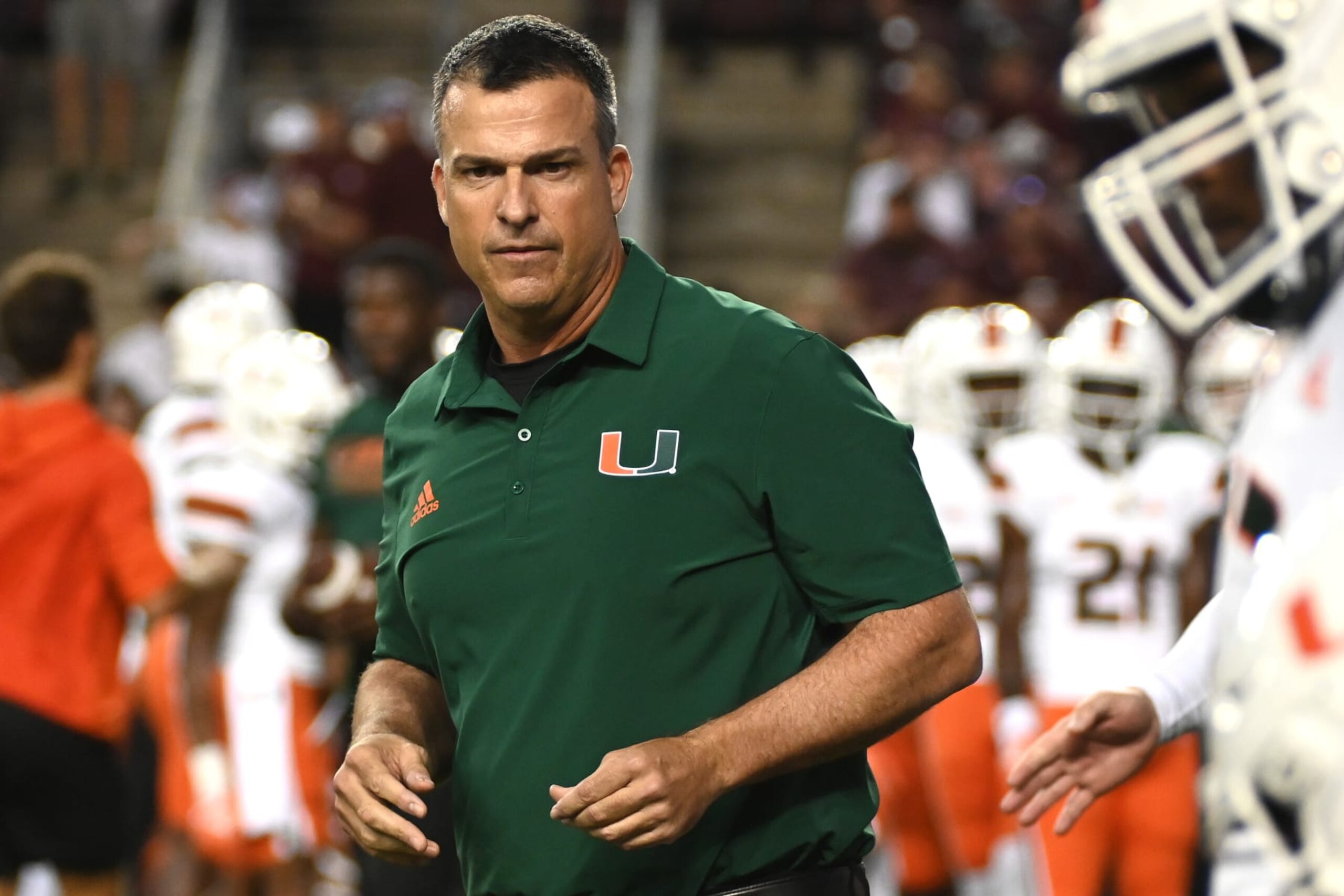COLLEGE STATION, TEXAS - SEPTEMBER 17: Head coach Mario Cristobal of the Miami Hurricanes looks on during warm ups prior to the game against the Texas A&M Aggies at Kyle Field on September 17, 2022 in College Station, Texas. (Photo by Jack Gorman/Getty Images) COLLEGE STATION, TEXAS - SEPTEMBER 17: Head coach Mario Cristobal of the Miami Hurricanes looks on during warm ups prior to the game against the Texas A&M Aggies at Kyle Field on September 17, 2022 in College Station, Texas. (Photo by Jack Gorman/Getty Images)