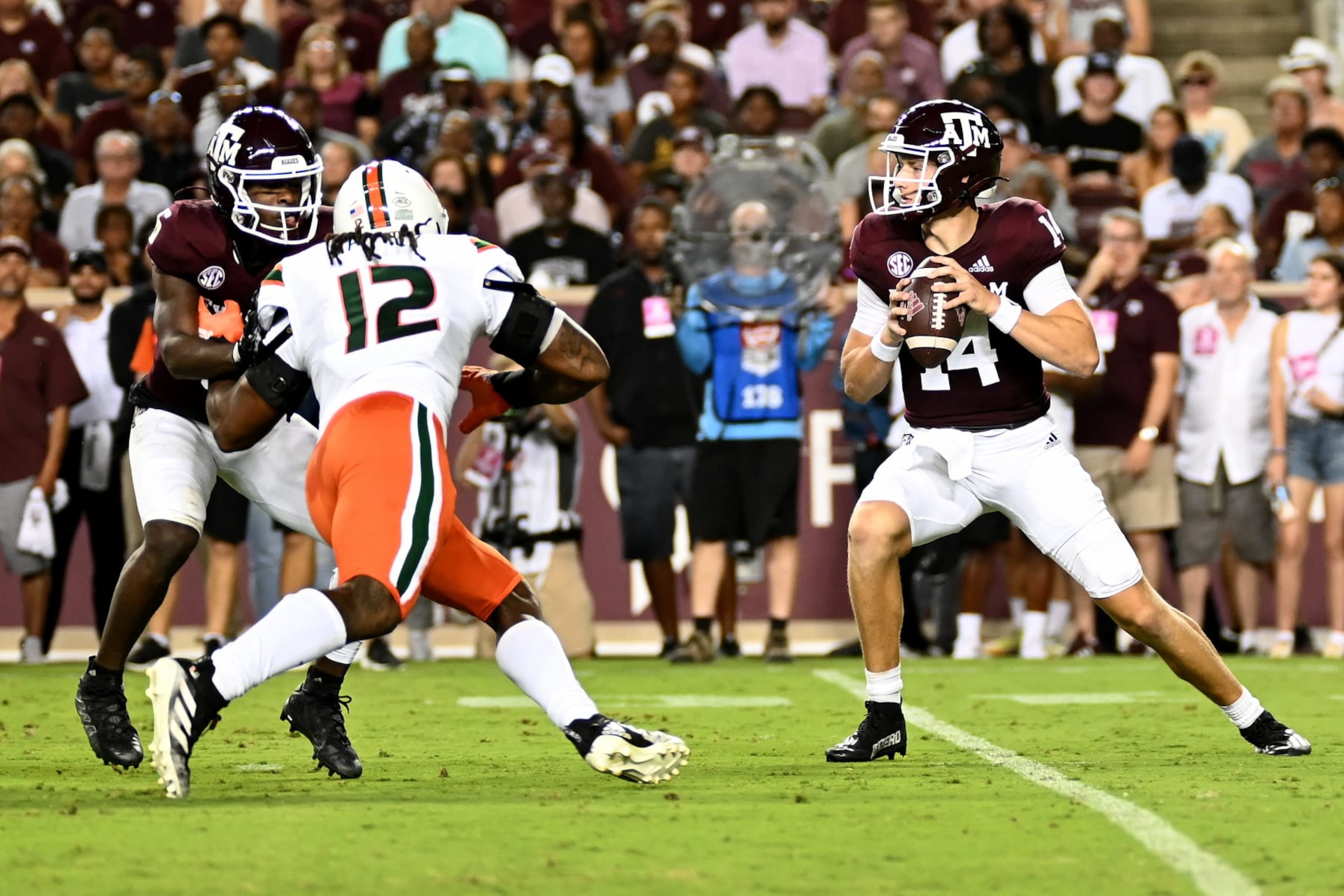 COLLEGE STATION, TEXAS - SEPTEMBER 17: Max Johnson #14 of the Texas A&M Aggies looks to pass against the Miami Hurricanes during the first half of the game at Kyle Field on September 17, 2022 in College Station, Texas. (Photo by Jack Gorman/Getty Images) COLLEGE STATION, TEXAS - SEPTEMBER 17: Max Johnson #14 of the Texas A&M Aggies looks to pass against the Miami Hurricanes during the first half of the game at Kyle Field on September 17, 2022 in College Station, Texas. (Photo by Jack Gorman/Getty Images)