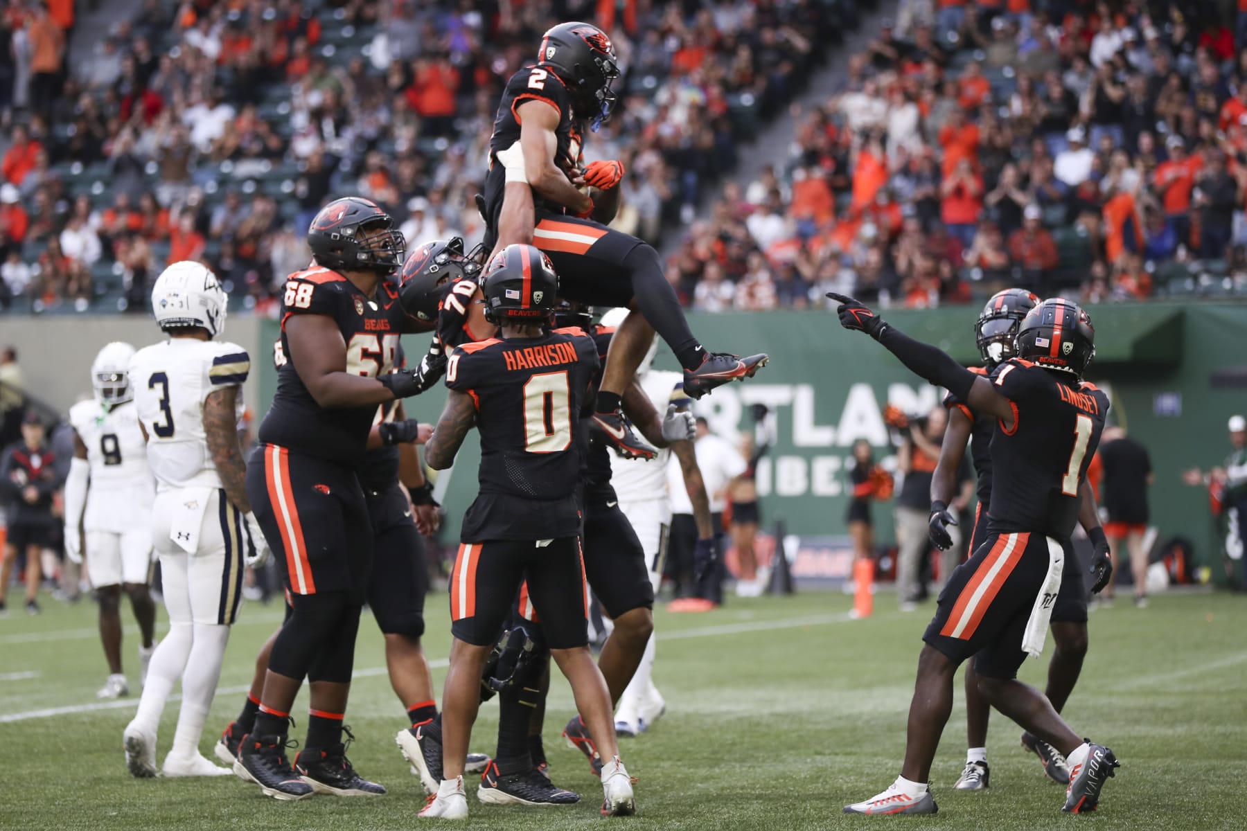 PORTLAND, OREGON - SEPTEMBER 17: Anthony Gould #2 of the Oregon State Beavers is lifted up by teammates after scoring a touchdown against the Montana State Bobcats during the first half at Providence Park on September 17, 2022 in Portland, Oregon. (Photo by Amanda Loman/Getty Images)